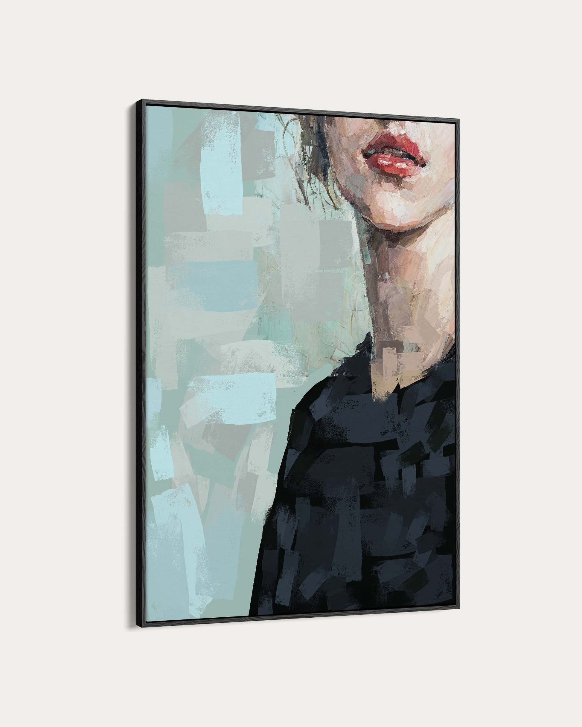 Framed artwork of a woman's face with abstract background
