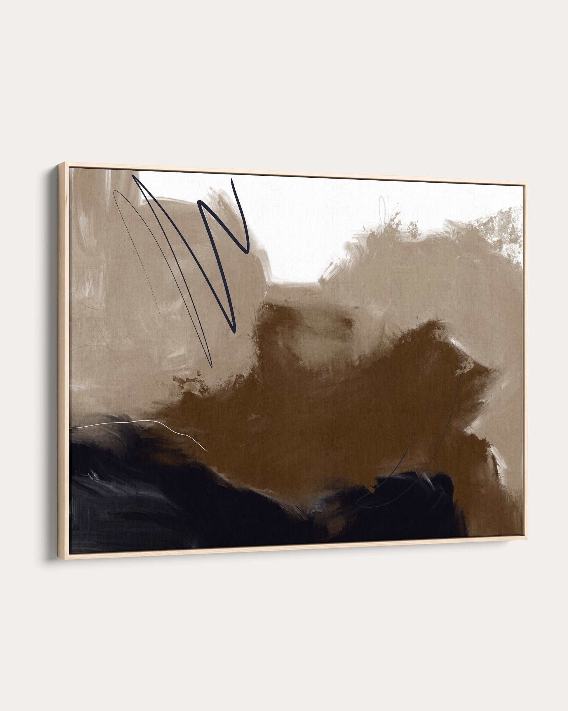 Abstract art piece with a gold frame on a white wall