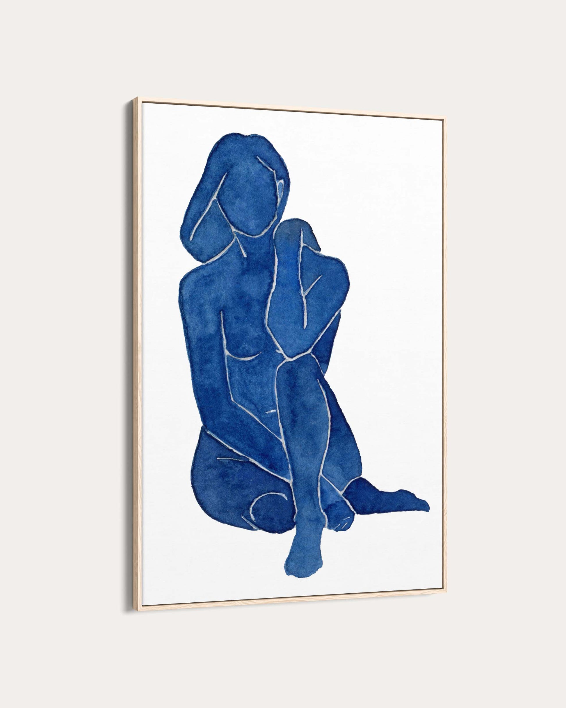 Framed artwork of a blue abstract figure on a white background