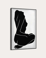Framed black and white abstract art of a nude figure on a light gray background