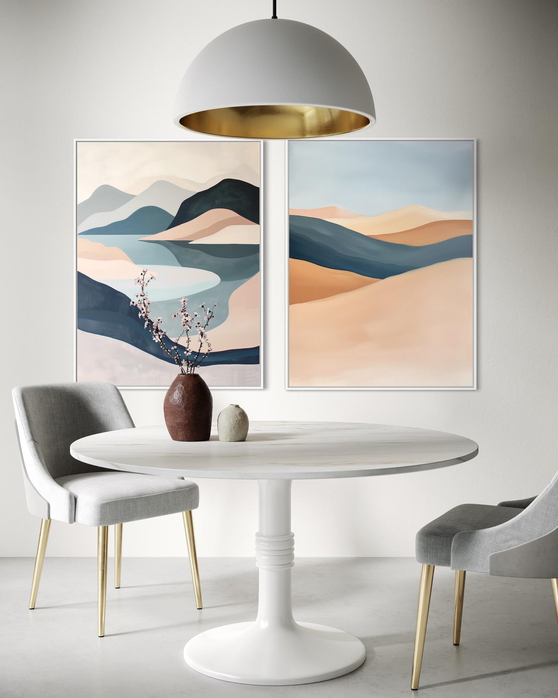 Dining room with a white table, gray chairs, and abstract landscape paintings on the wall.
