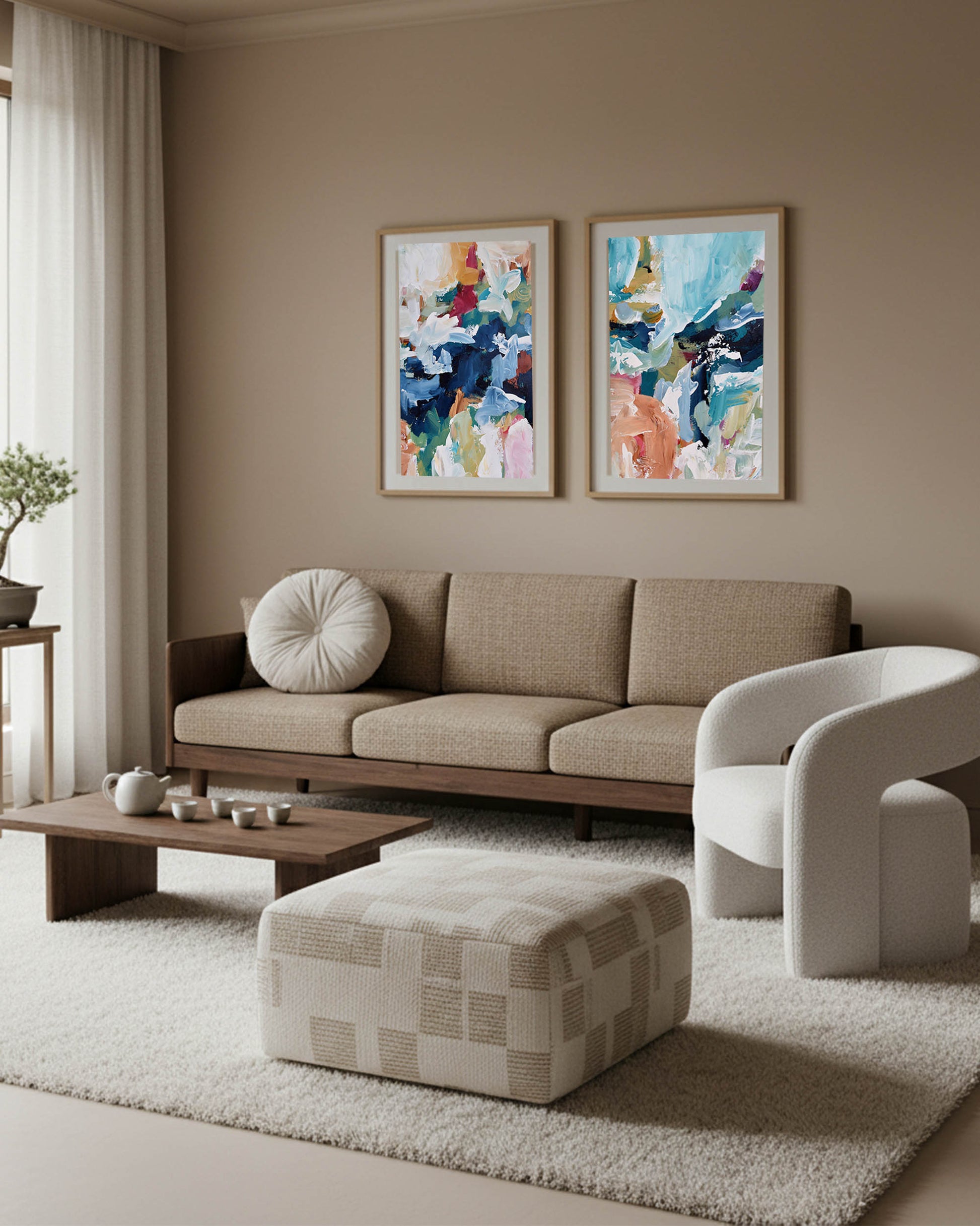 colourful large abstract wall art in oak frames in minimal japandi living room with brown sofa and geometric checkered boucle ottoman and white occasion chair.