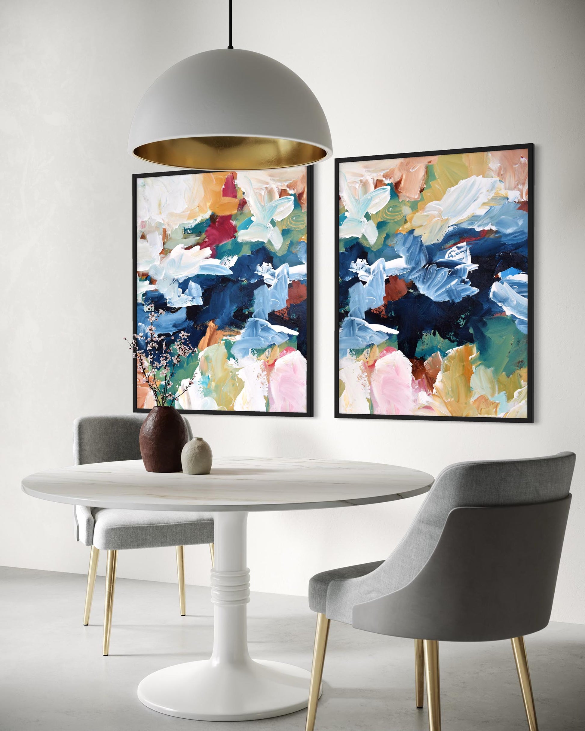 Dining room with a white table, gray chairs, and abstract art on the wall.