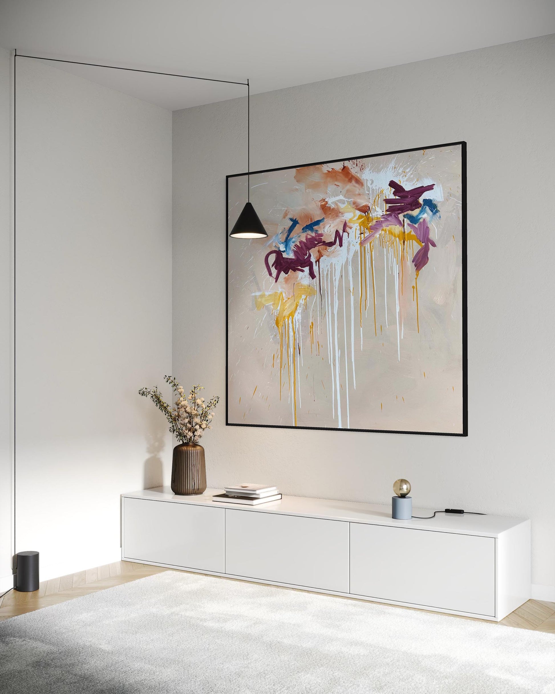 Modern living room with abstract art on the wall and a white console table.