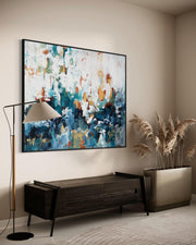 Modern living room with abstract painting, floor lamp, and decorative plant.