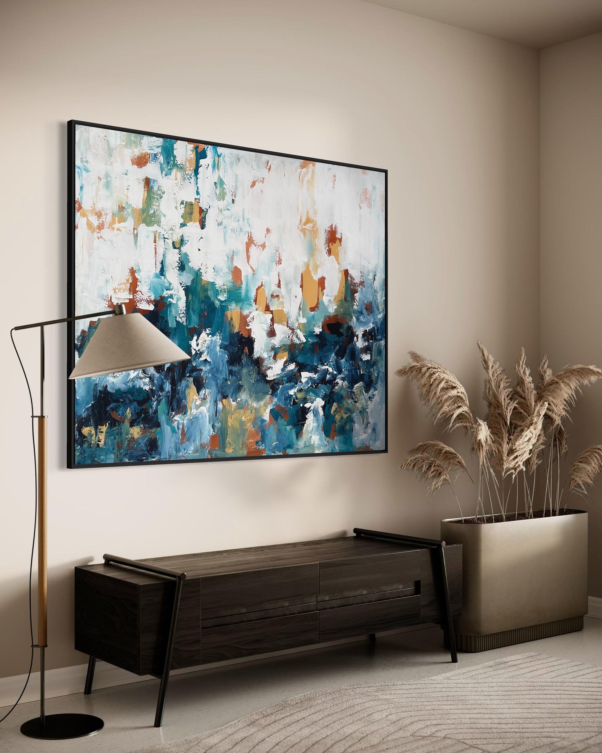Modern living room with abstract painting, floor lamp, and decorative plant.