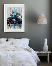 Modern bedroom with abstract art, pendant light, and plants.