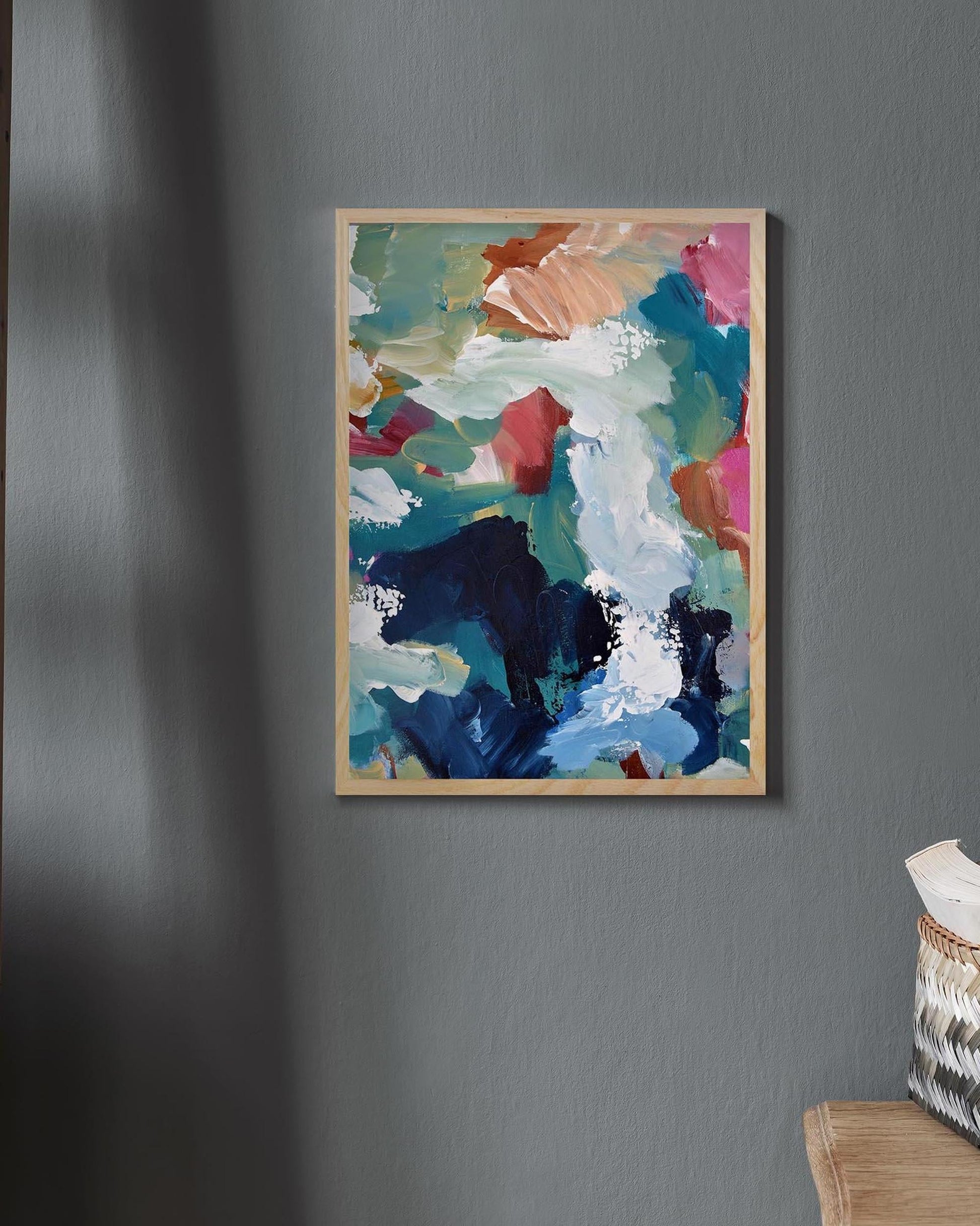 Abstract painting on a gray wall with a textured surface