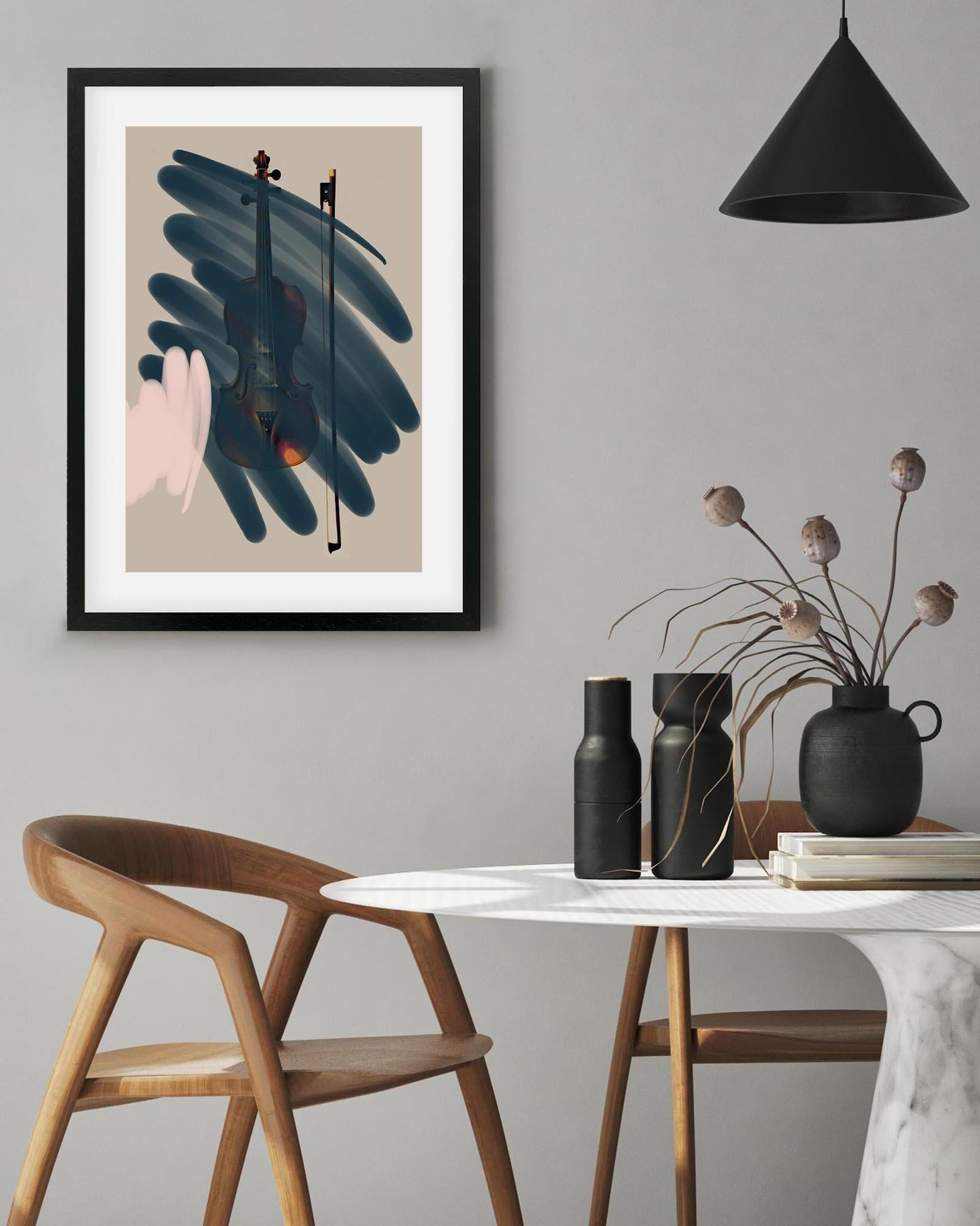 Modern interior with framed abstract art, wooden chair, and decorative table.