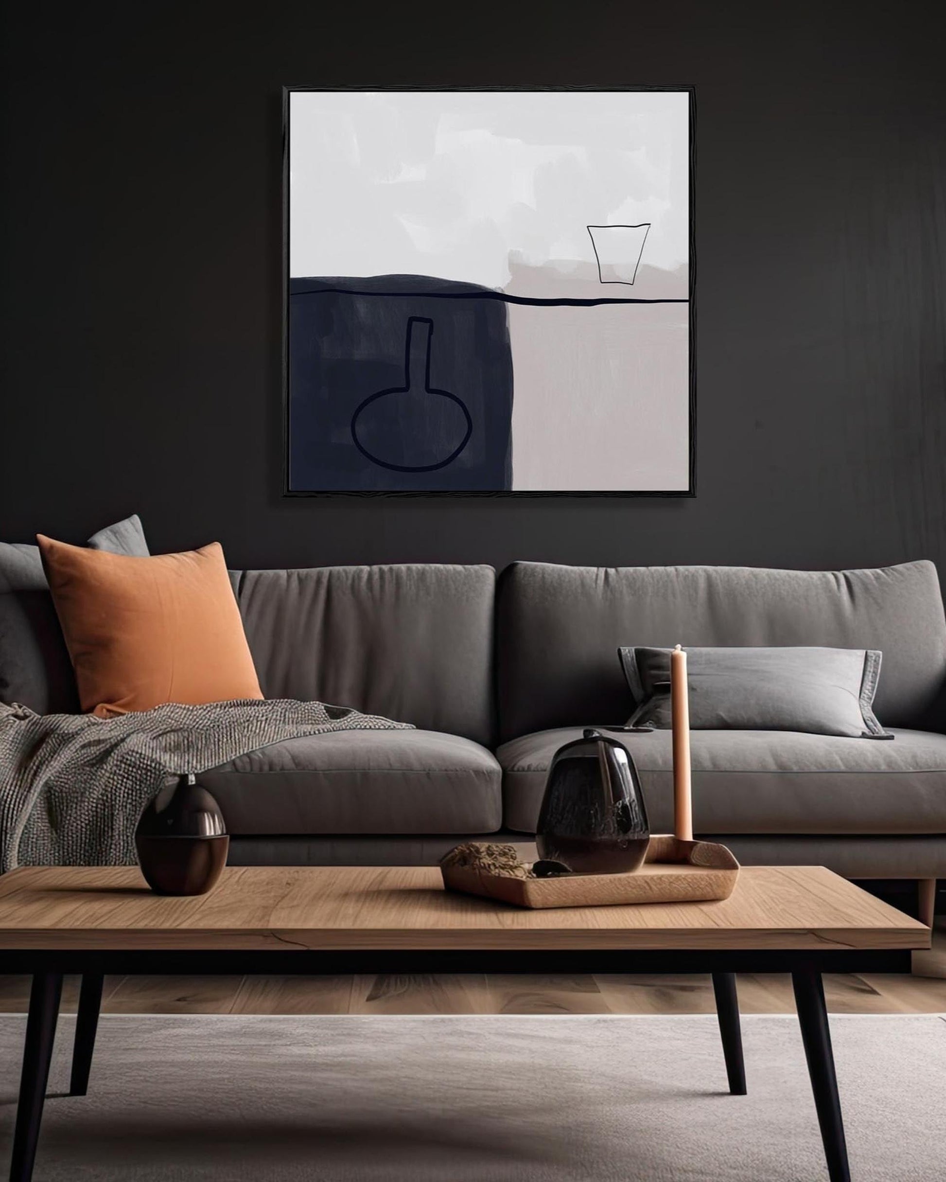 Modern living room with a gray sofa, wooden coffee table, and abstract art on the wall.