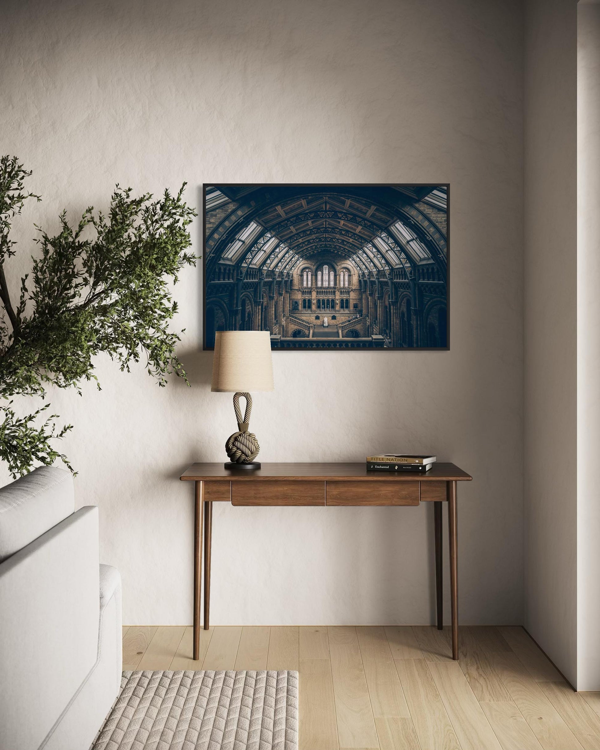 Modern interior with a wooden console table, lamp, and decorative items against a neutral wall.