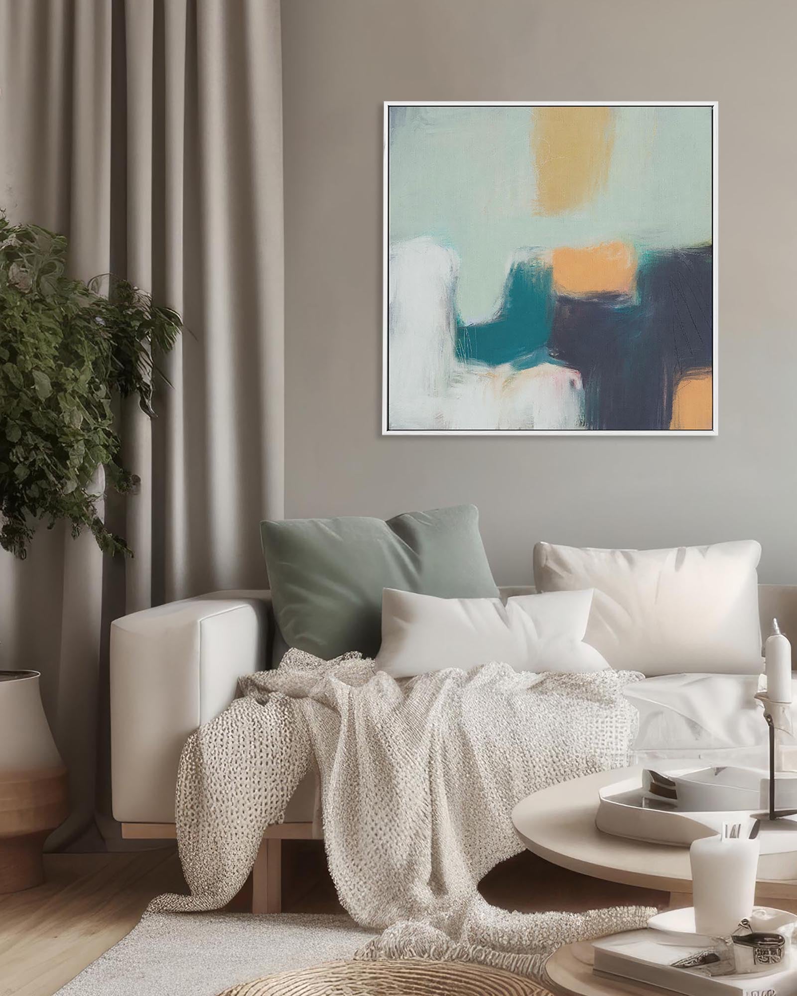 Living room with a sofa, coffee table, and abstract art on the wall.