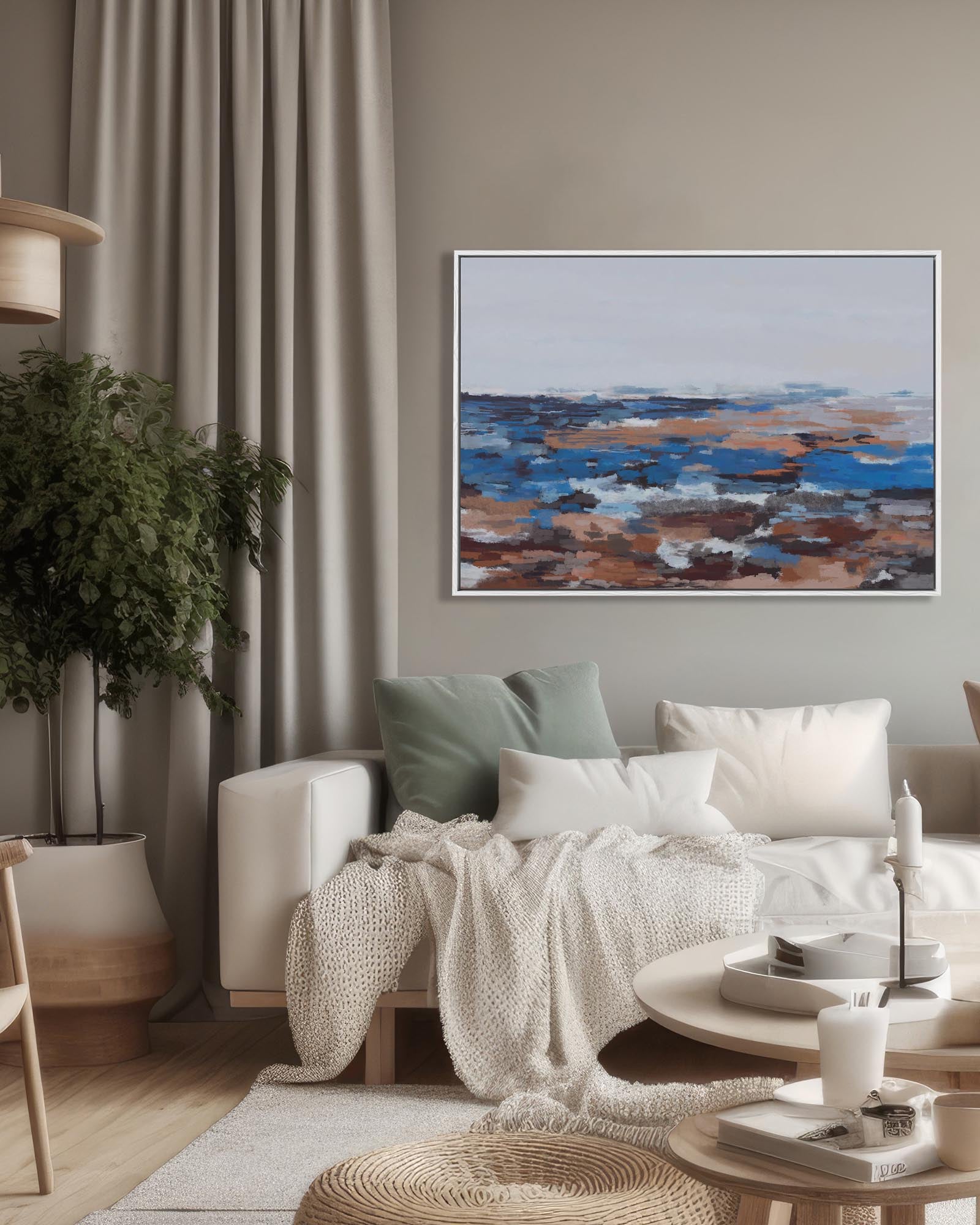Living room with a sofa, coffee table, and abstract painting on the wall.