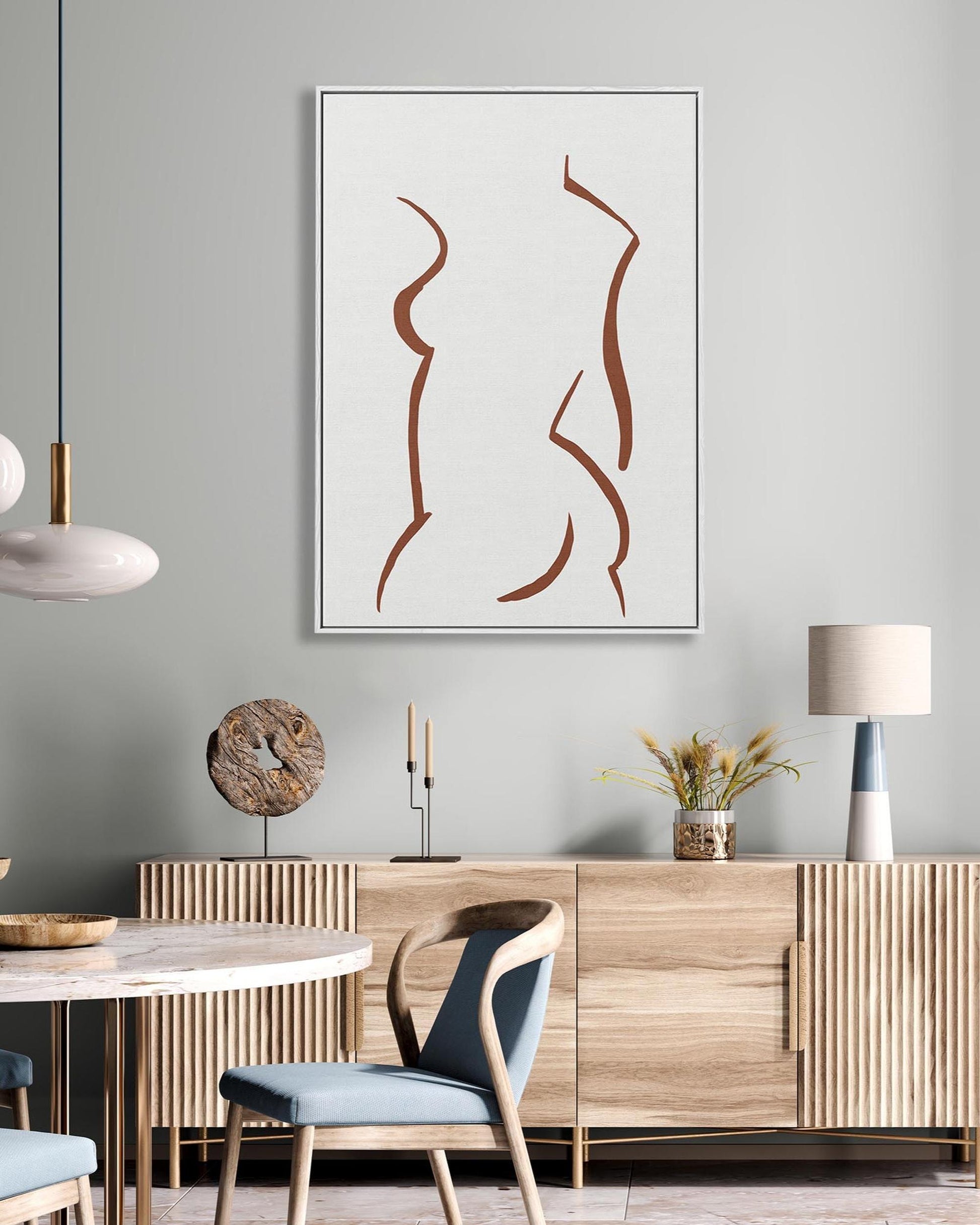 Modern interior with abstract art, wooden furniture, and decorative items.