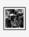 Framed black and white abstract art print on a white wall