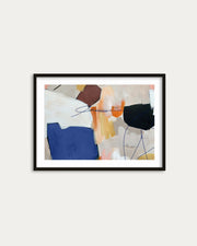 Framed abstract art print on a white wall