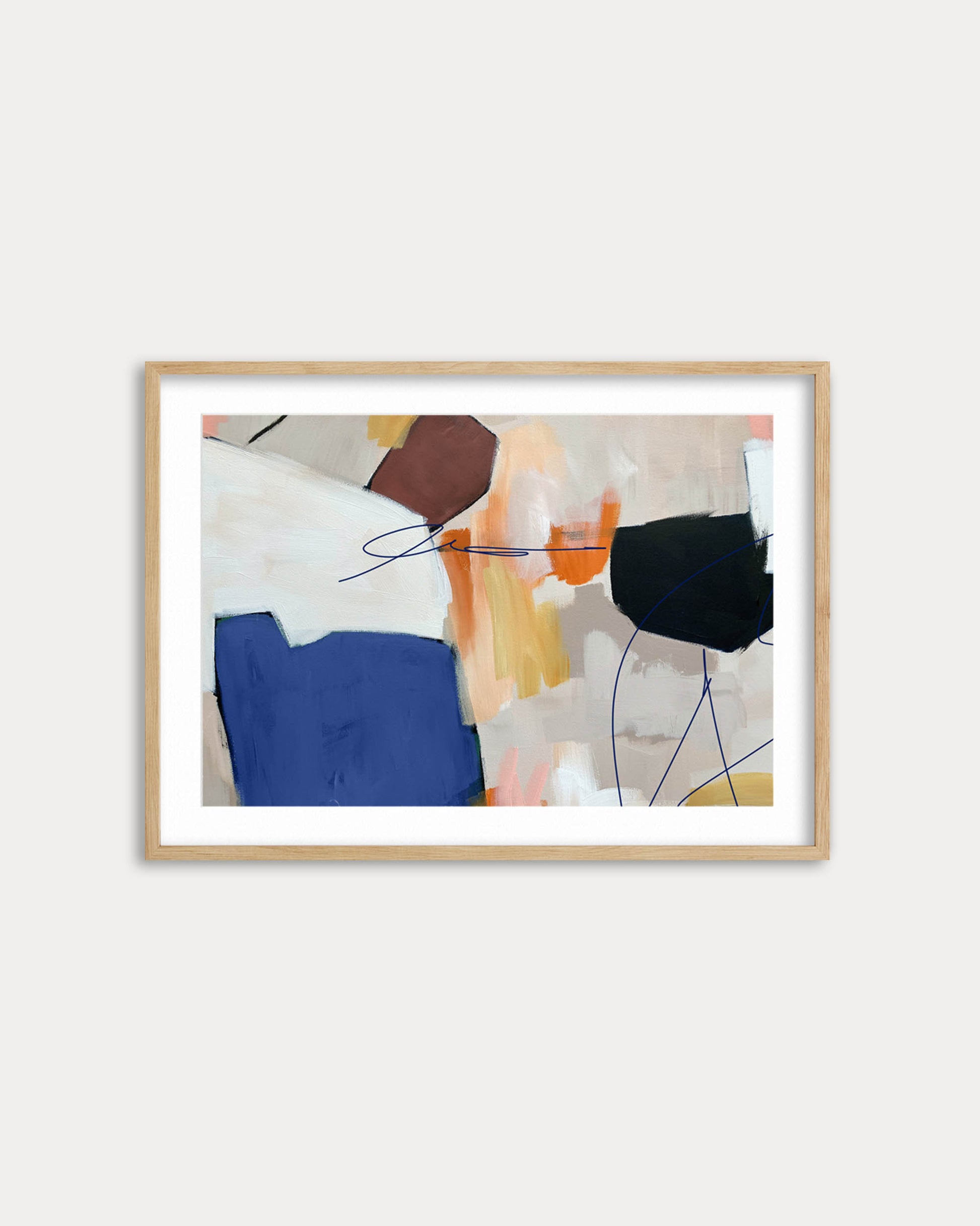 Framed abstract art print on a white wall