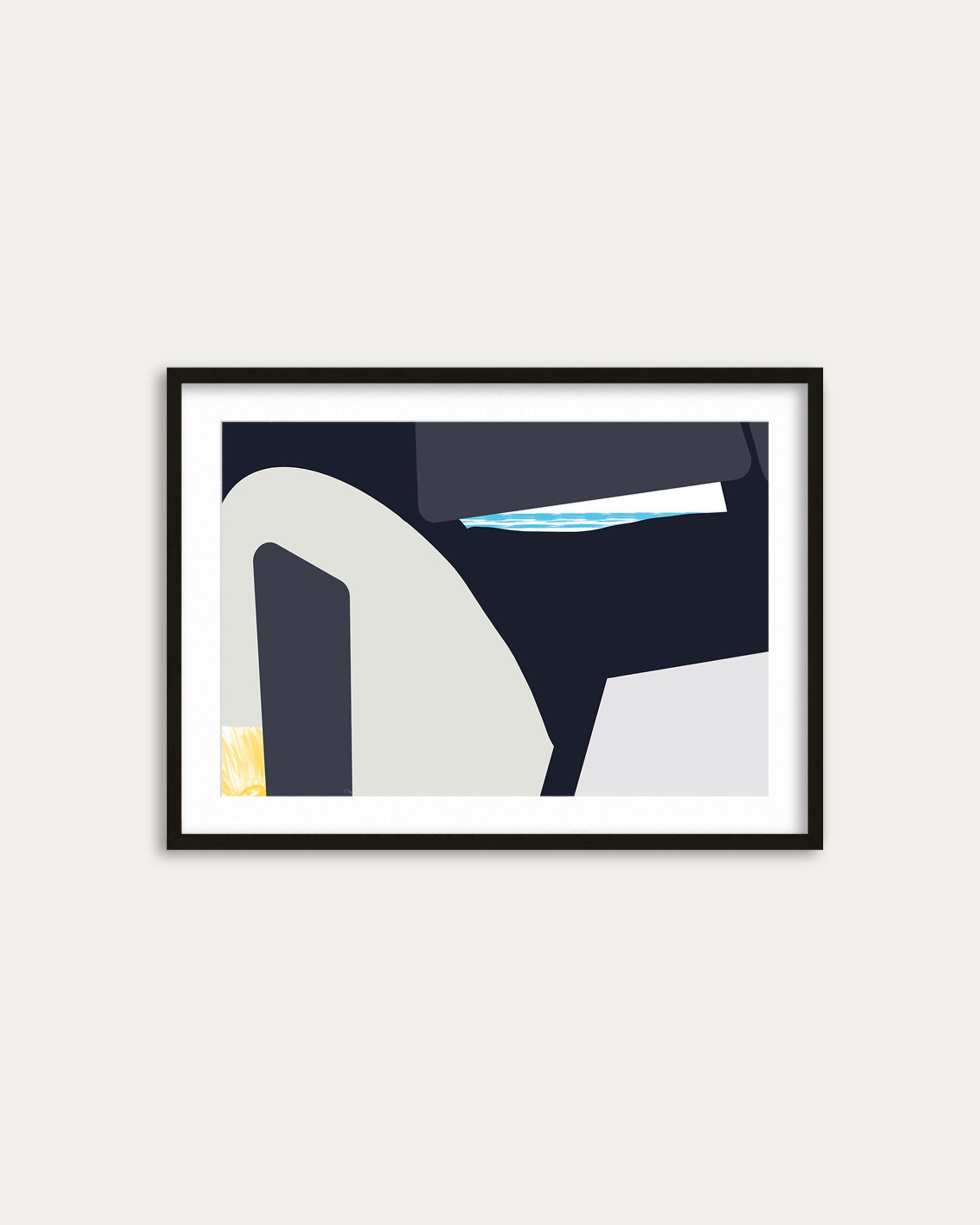 Framed abstract art print on a white wall
