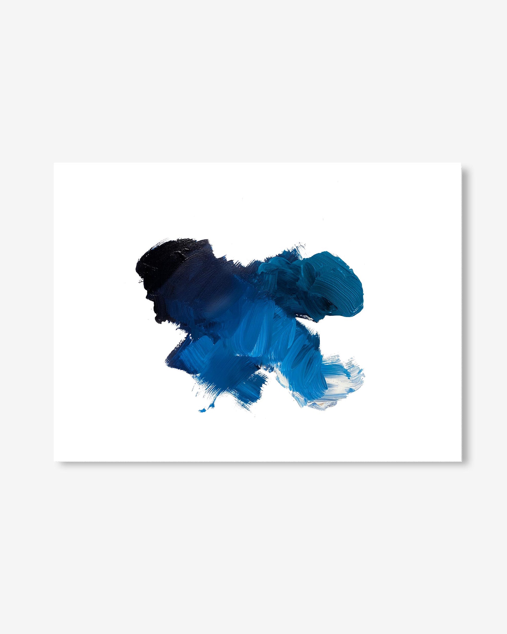 Blue and black ink splatter on a white background