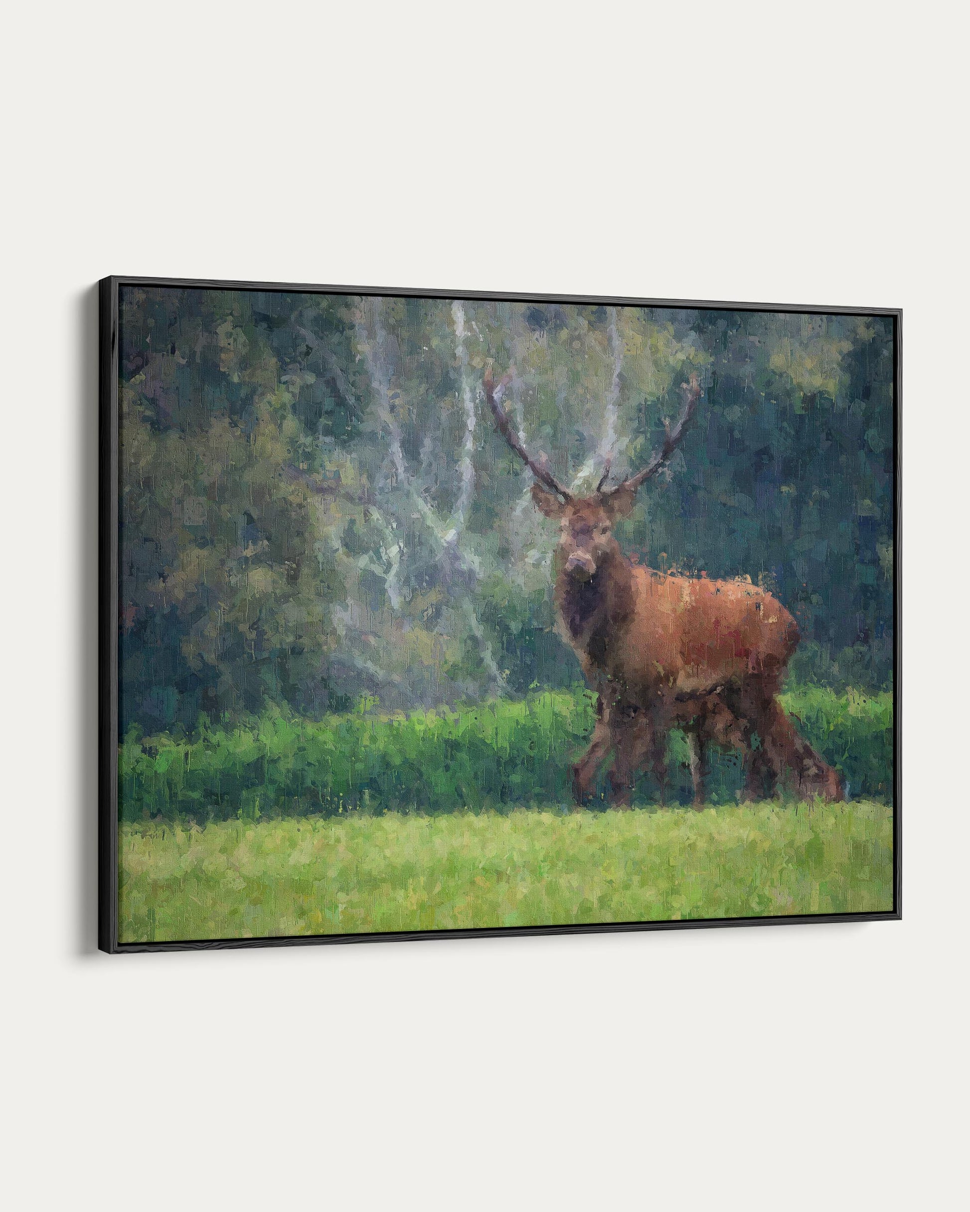 Framed painting of a stag in a forest setting
