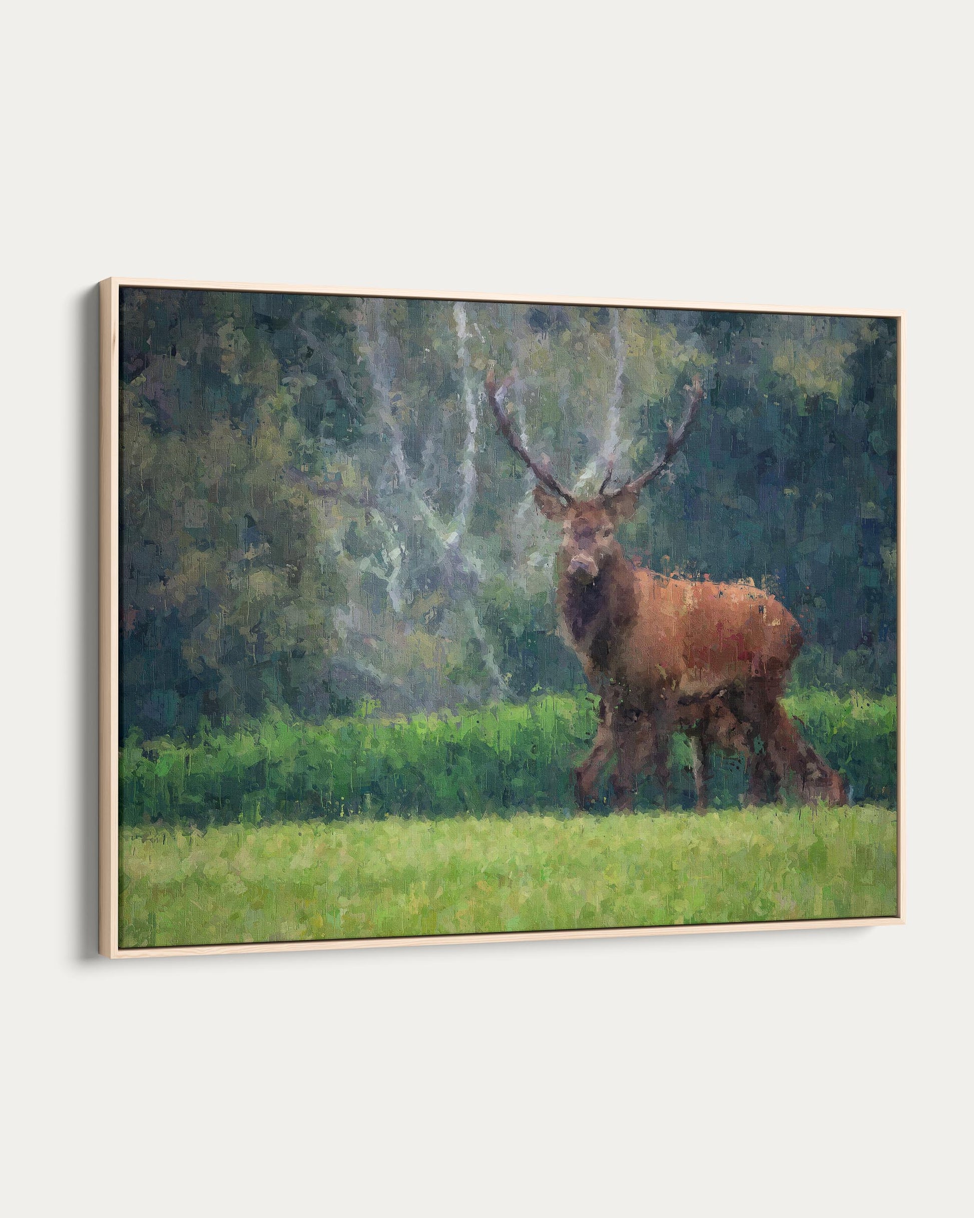 Framed painting of a stag in a forest setting