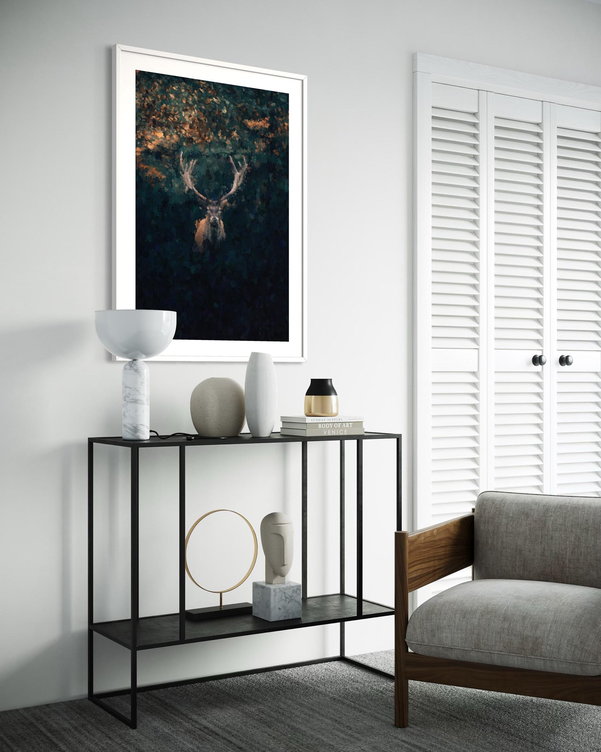 Modern living room with a console table, decorative items, and a framed artwork on the wall.