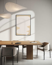 Modern dining room with wooden table, chairs, and abstract art on the wall.