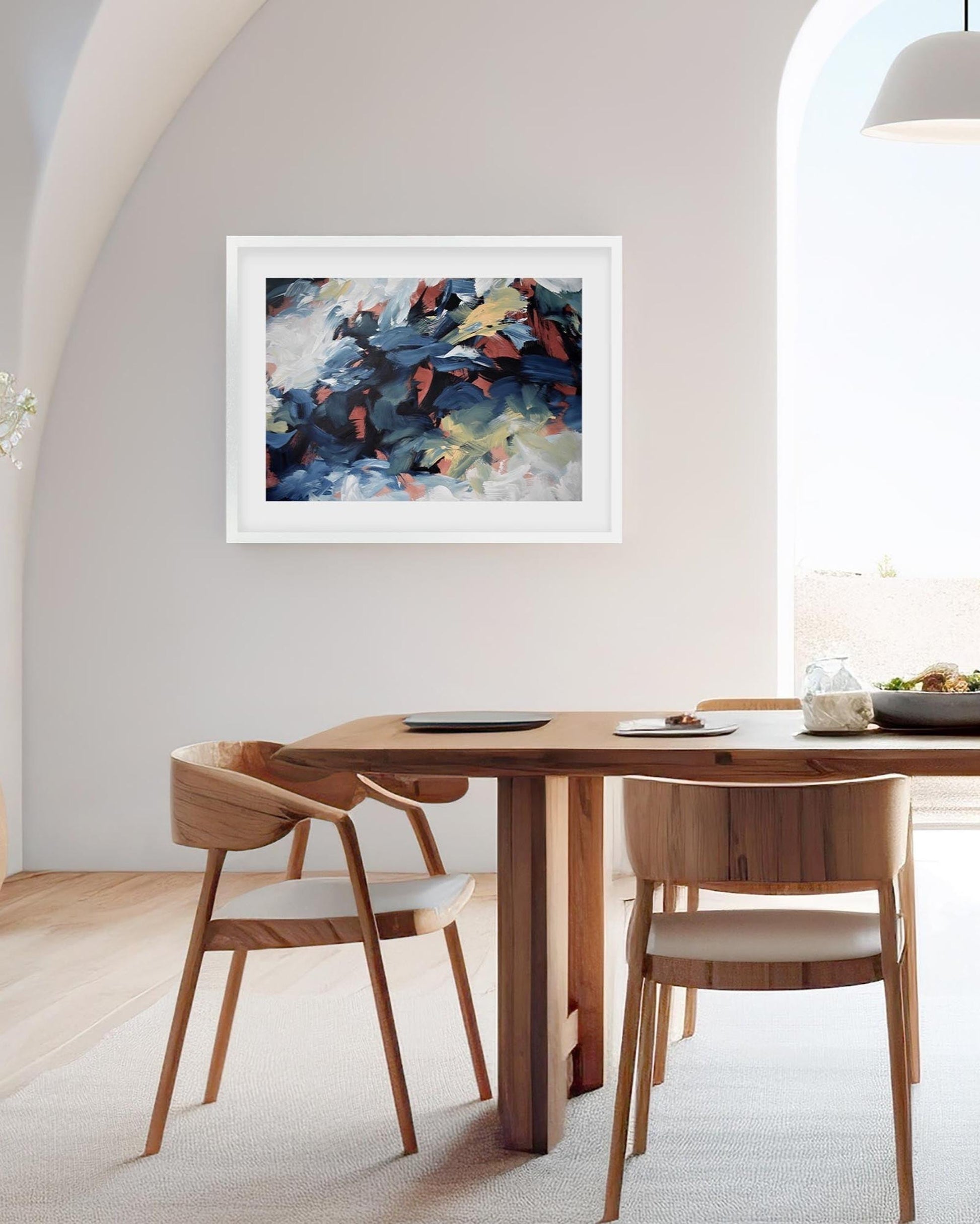 Dining room with wooden table and chairs, abstract painting on the wall.