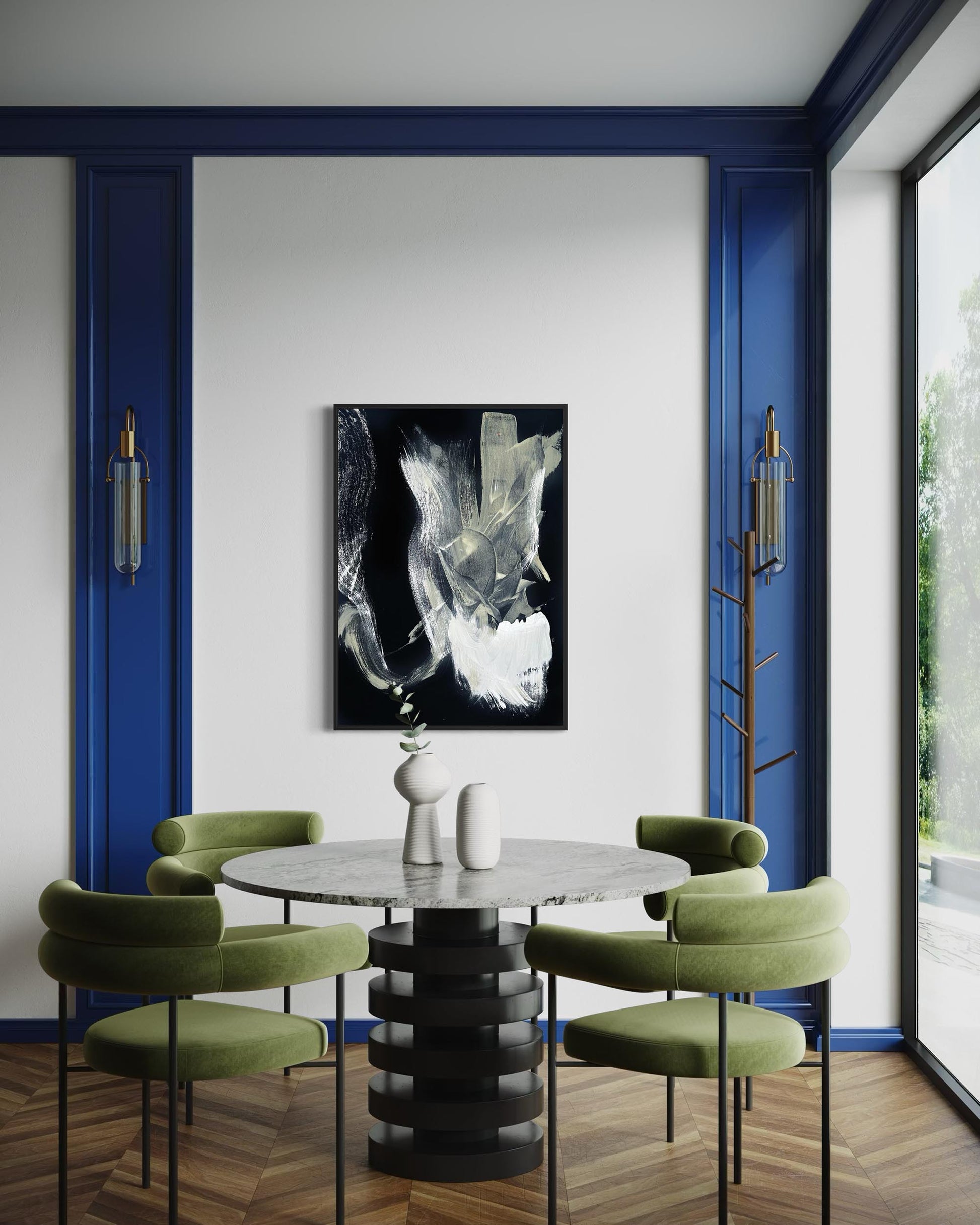 Modern dining room with a round table and green chairs, featuring a black and white abstract painting on the wall.