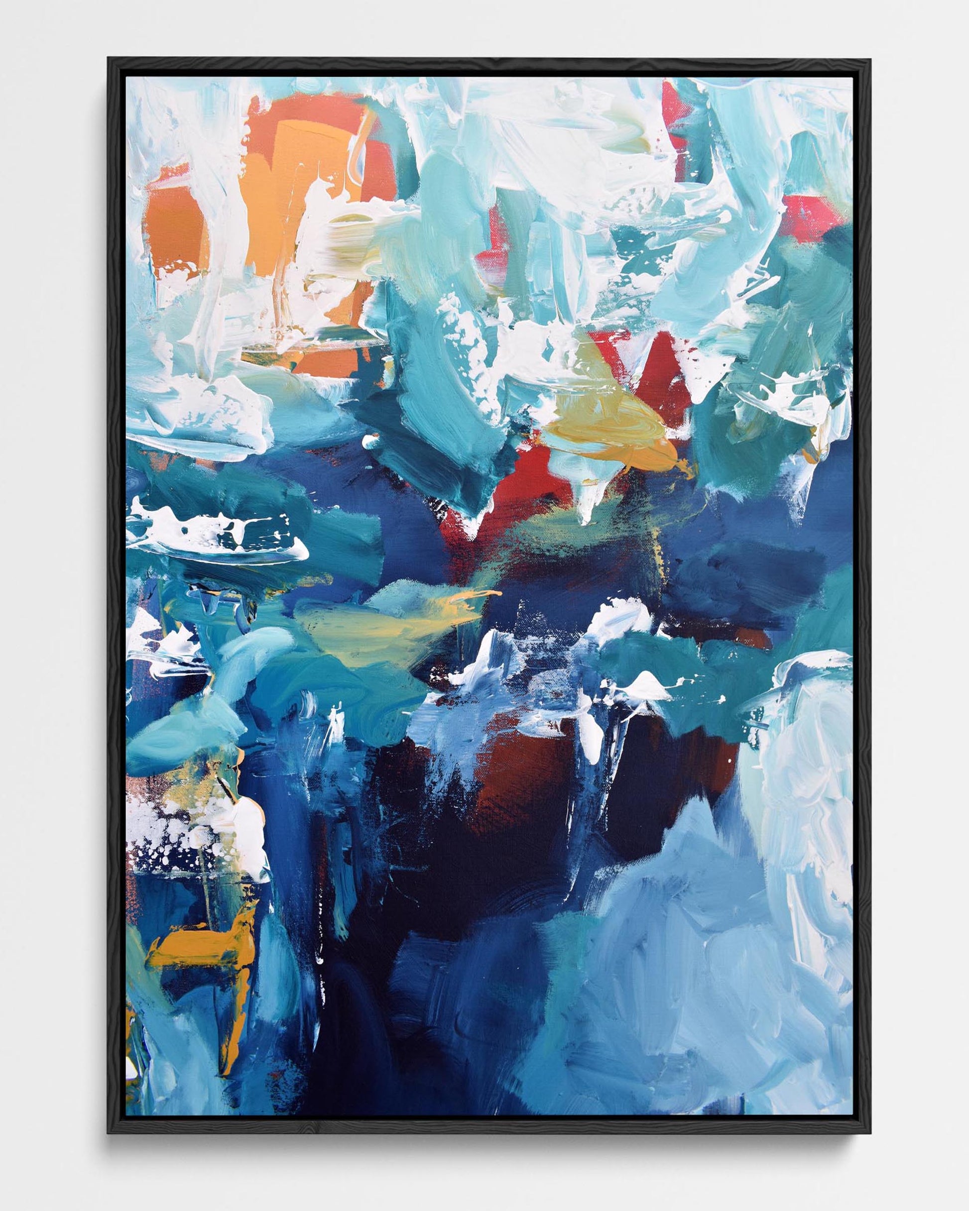 A framed canvas with an abstract design featuring modern blue, teal, and yellow ochre tones.