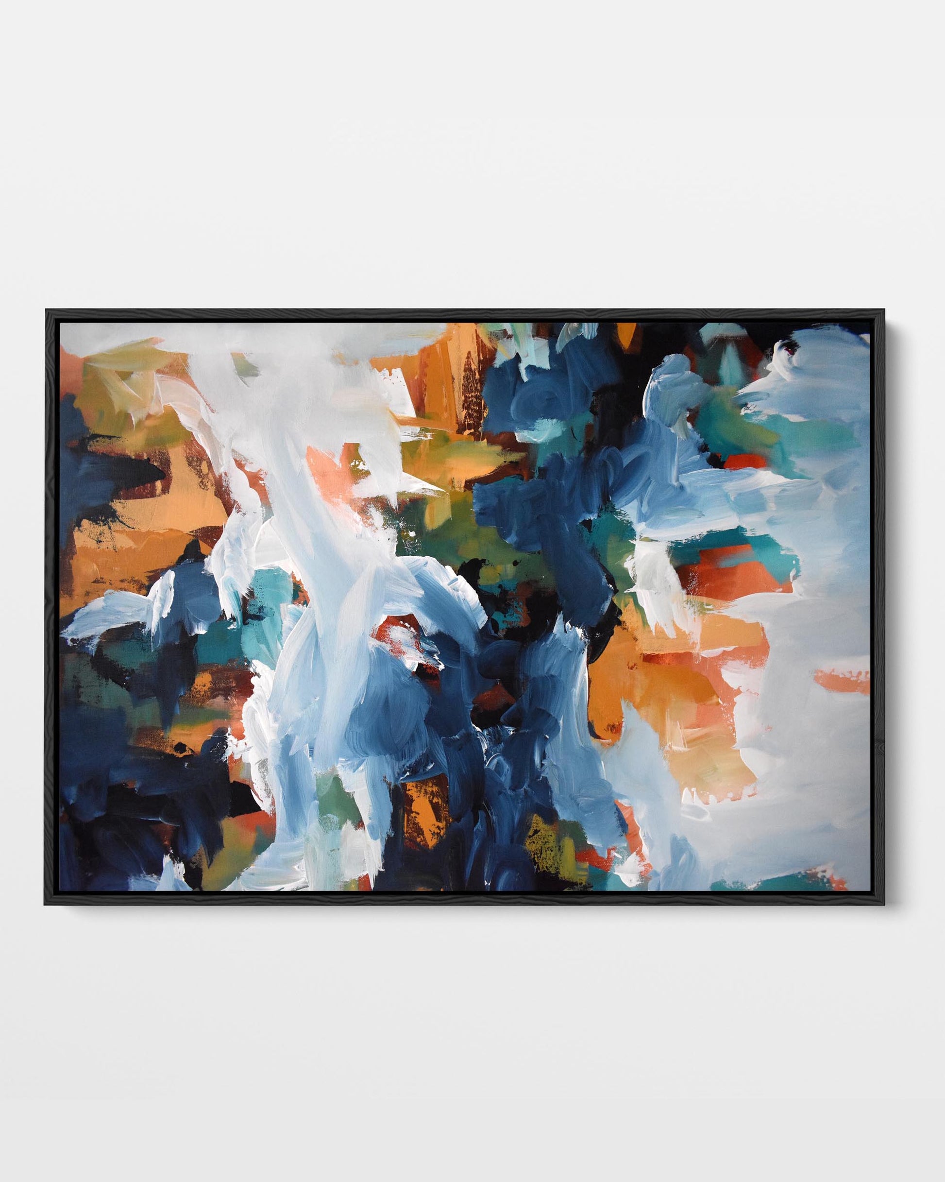 A framed canvas print with an abstract design featuring modern blue, orange, green, and red tones.