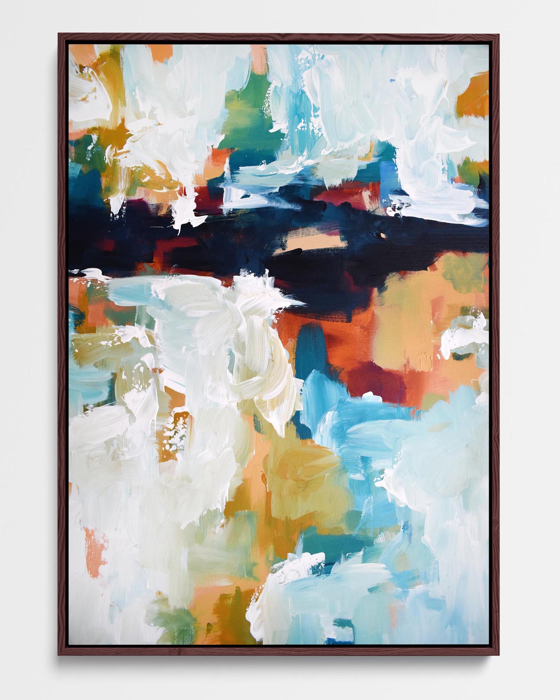 A framed canvas with an abstract design featuring modern white, yellow, green, blue, and red tones.
