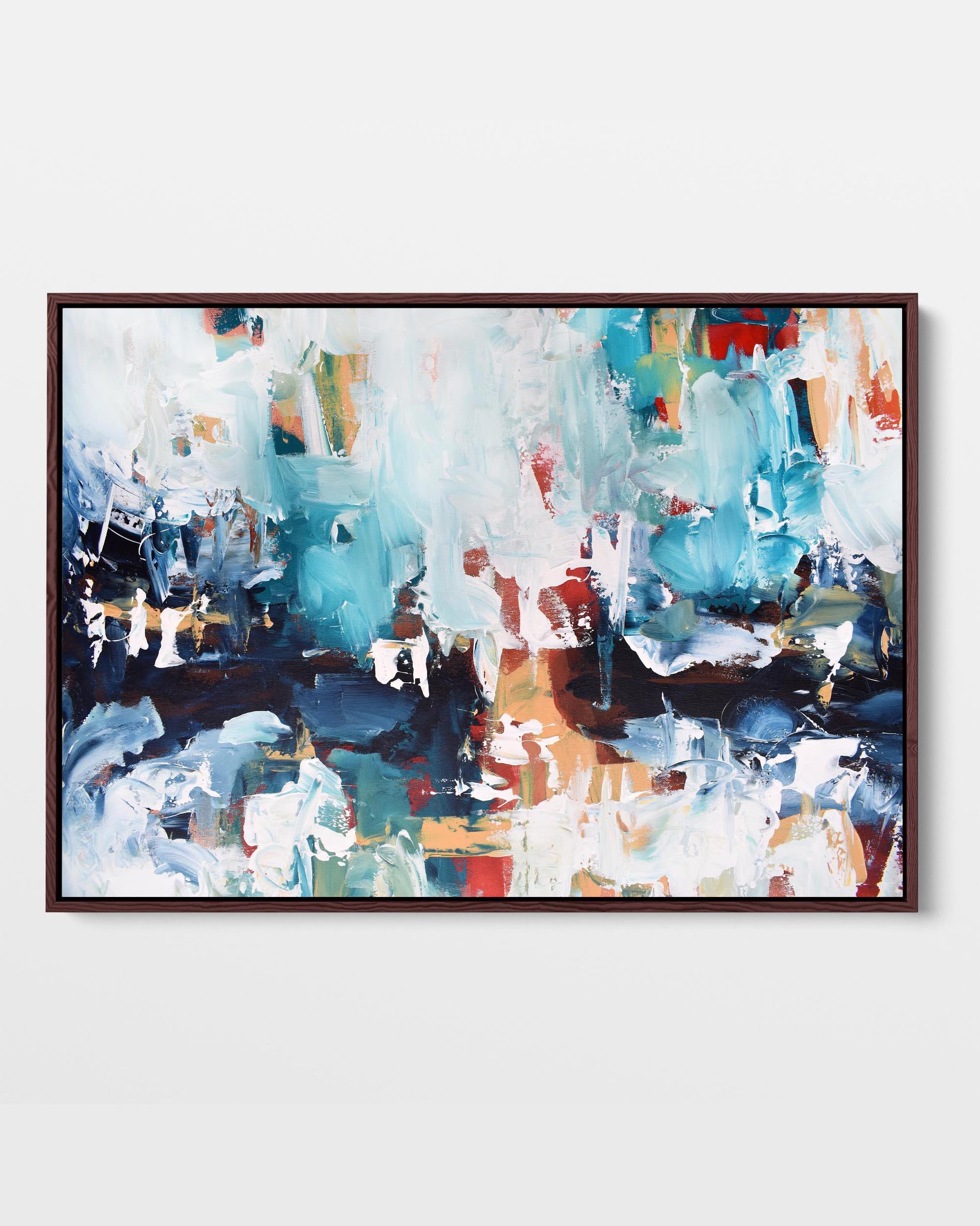 A framed canvas with an abstract design featuring modern blue, white, teal, and red tones.