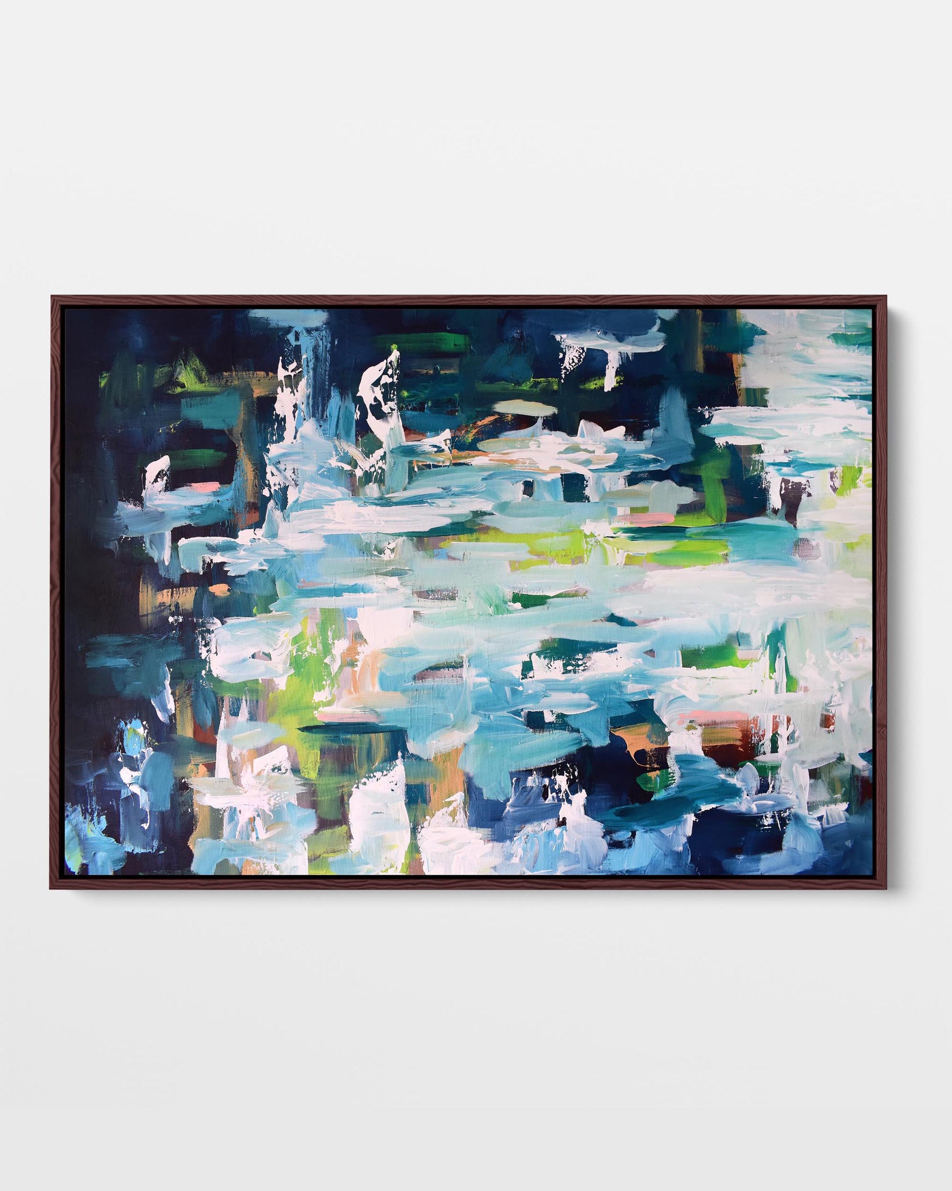 A framed canvas with an abstract design featuring modern blue, green, and orange tones, presented in a vertical orientation.