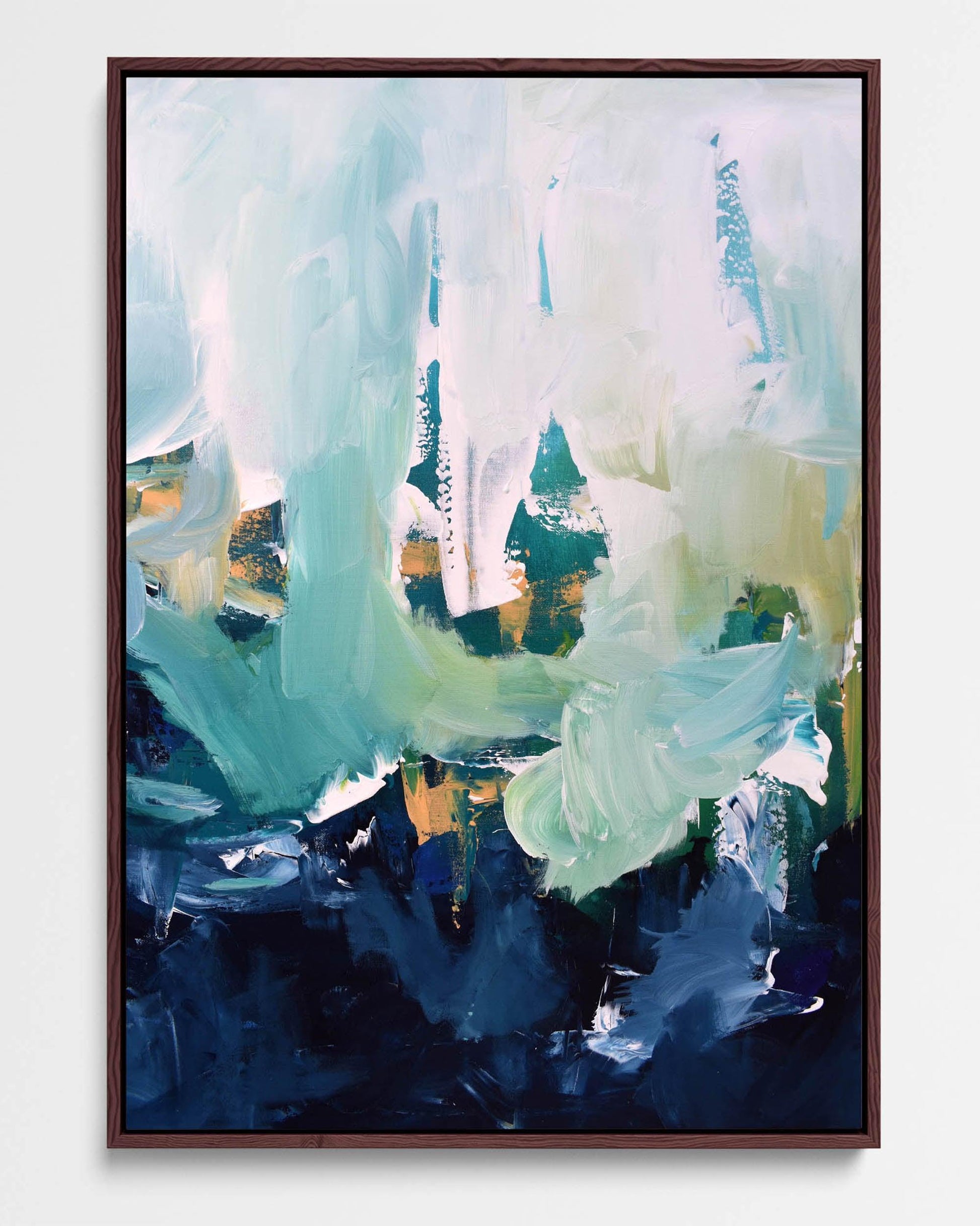 A framed canvas featuring an abstract design with modern blue, white, green, and ochre tones.