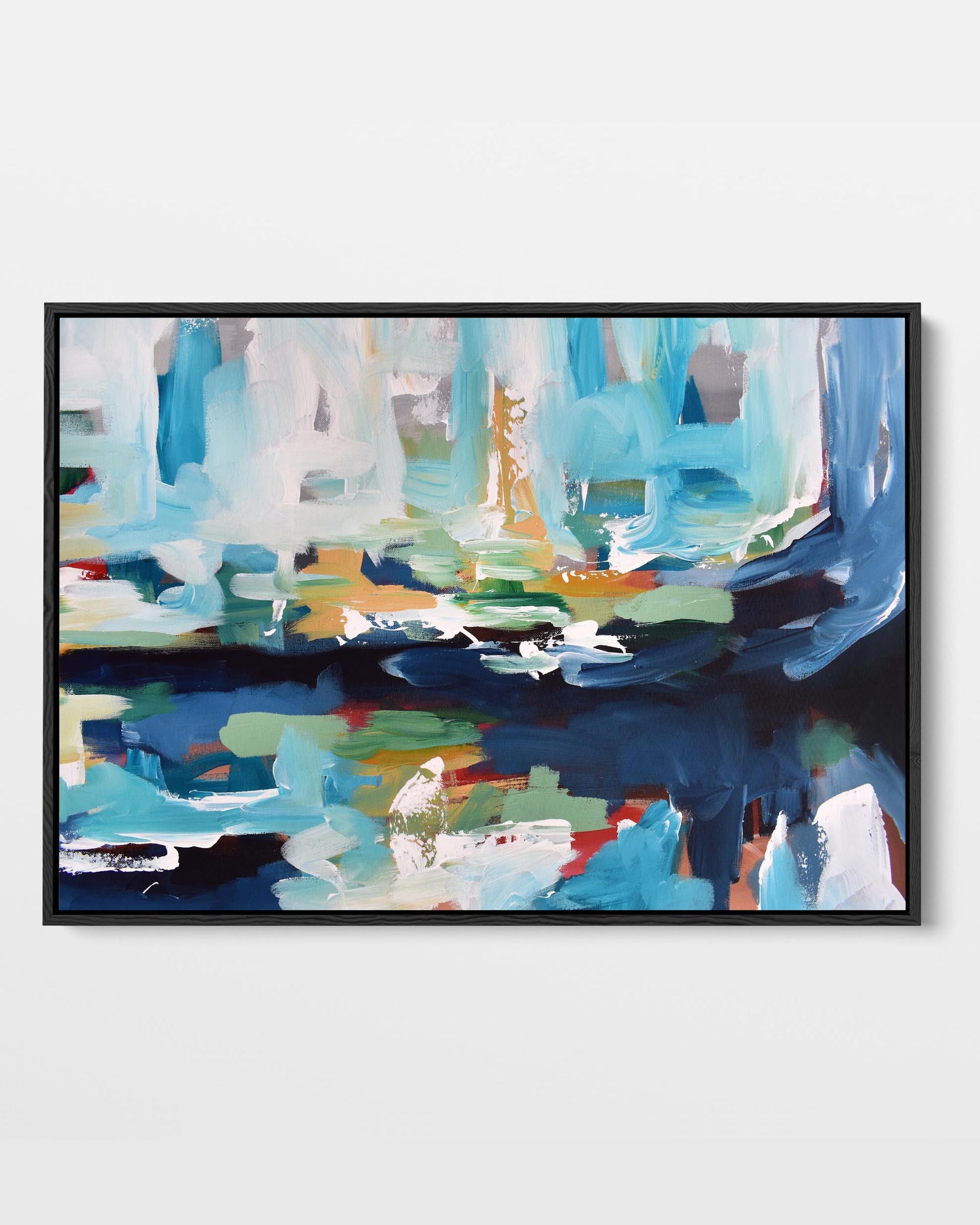 A framed canvas print with an abstract design featuring modern blue, yellow, green, and red tones.
