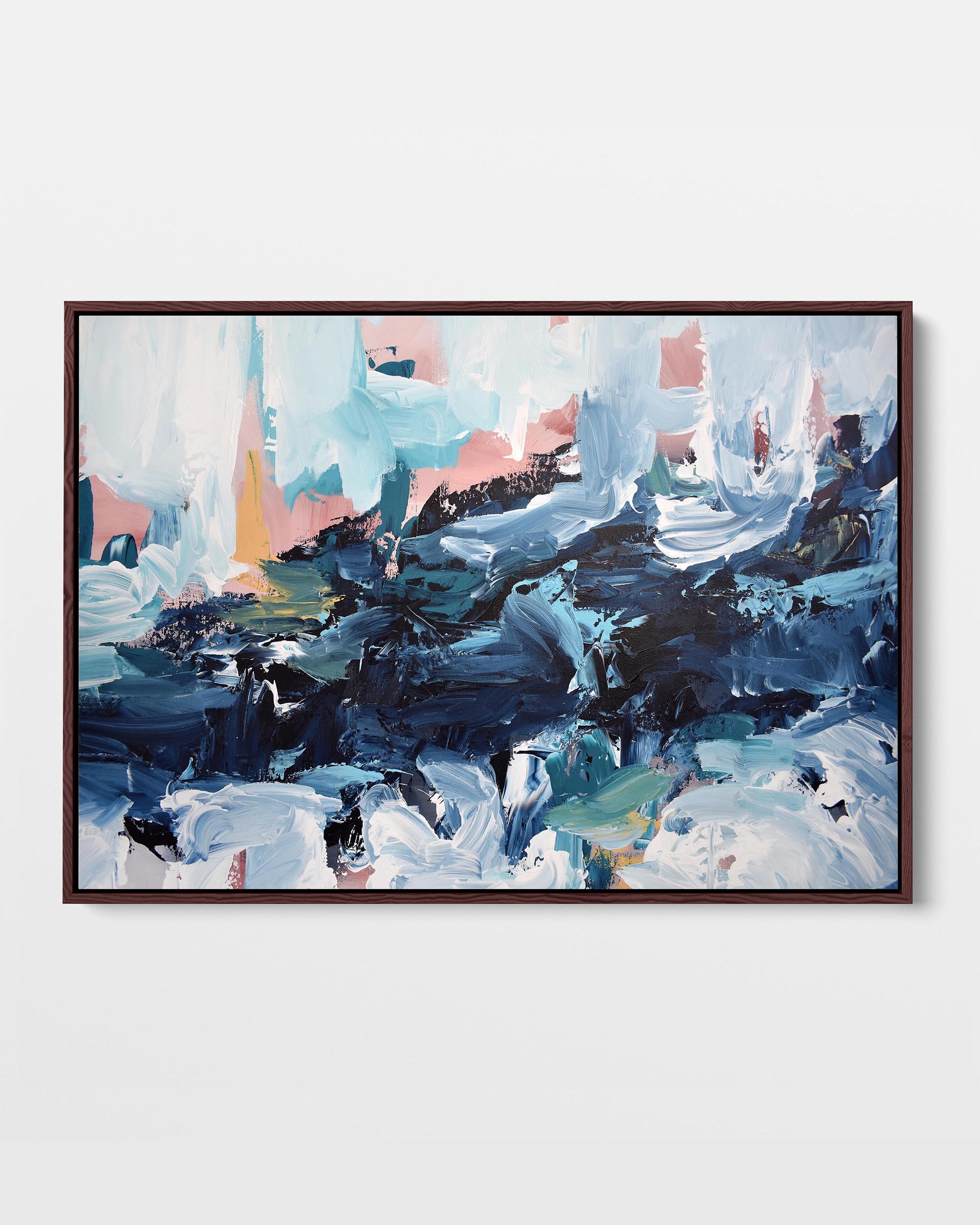 A framed canvas print with an abstract design featuring modern blue, pink, and orange tones, stretched on a wooden frame.