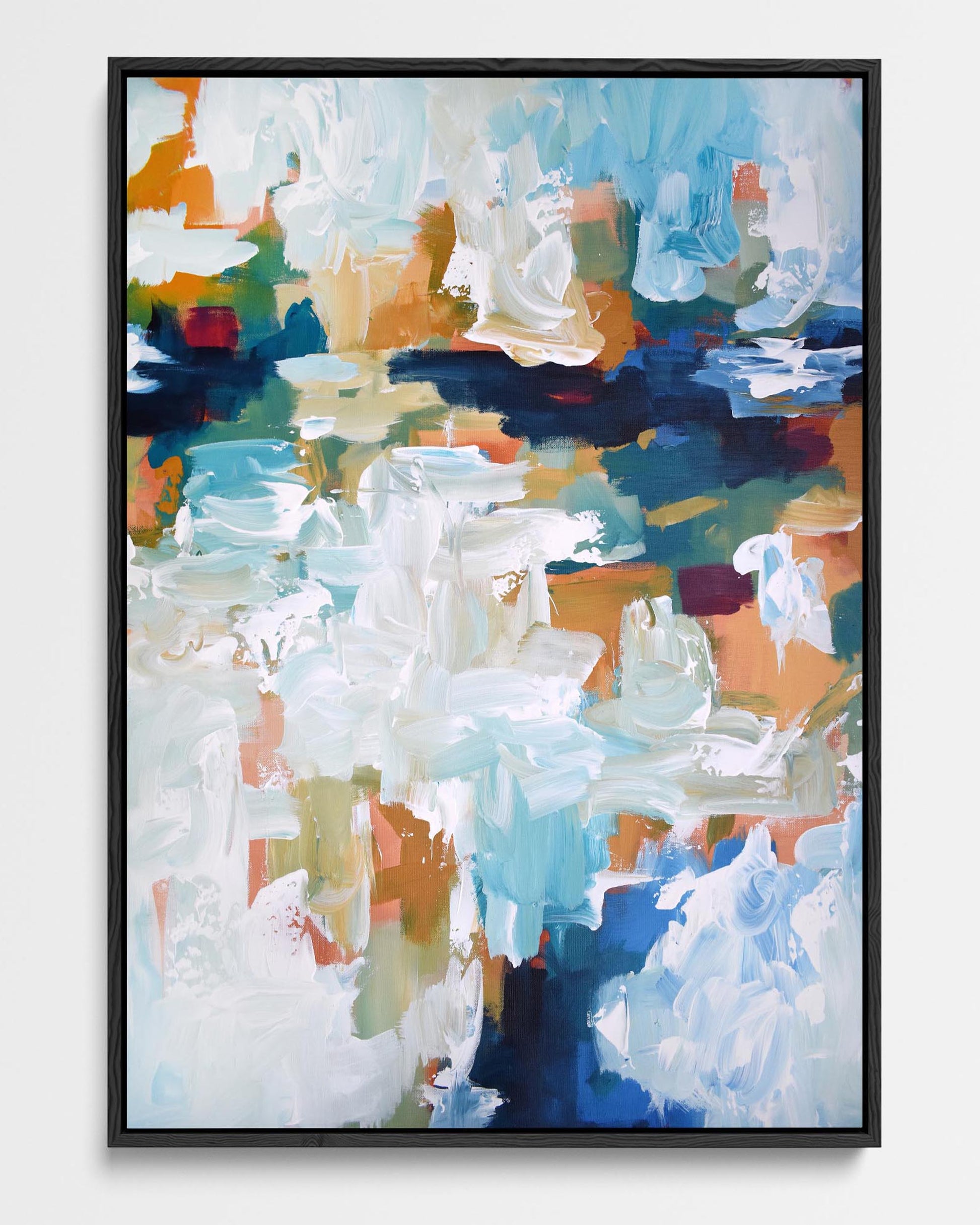 A framed canvas featuring an abstract design with modern white, blue, orange, and green tones.