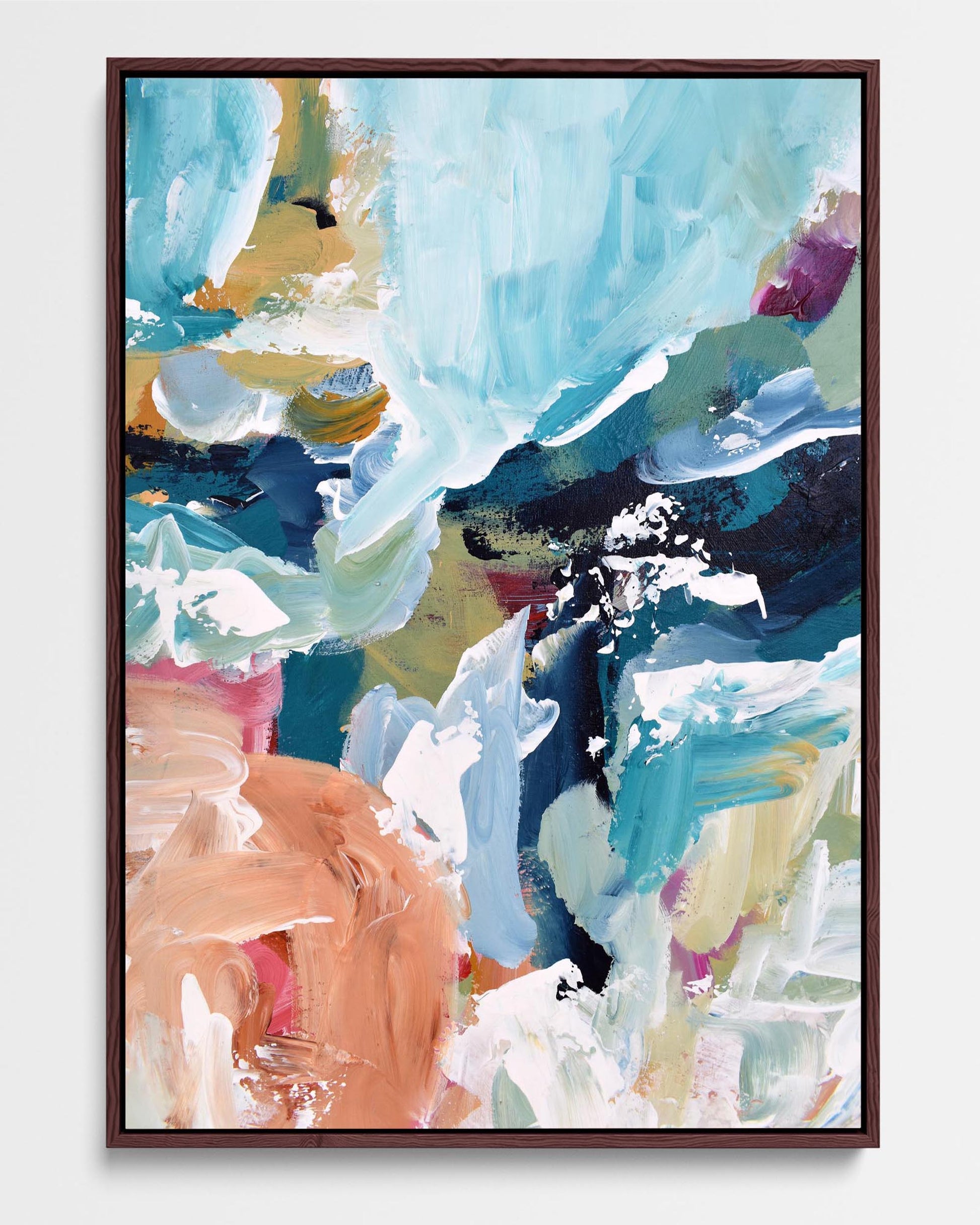 A vibrant abstract canvas print with a modern blue, brown, and white color palette, framed in either black or white.