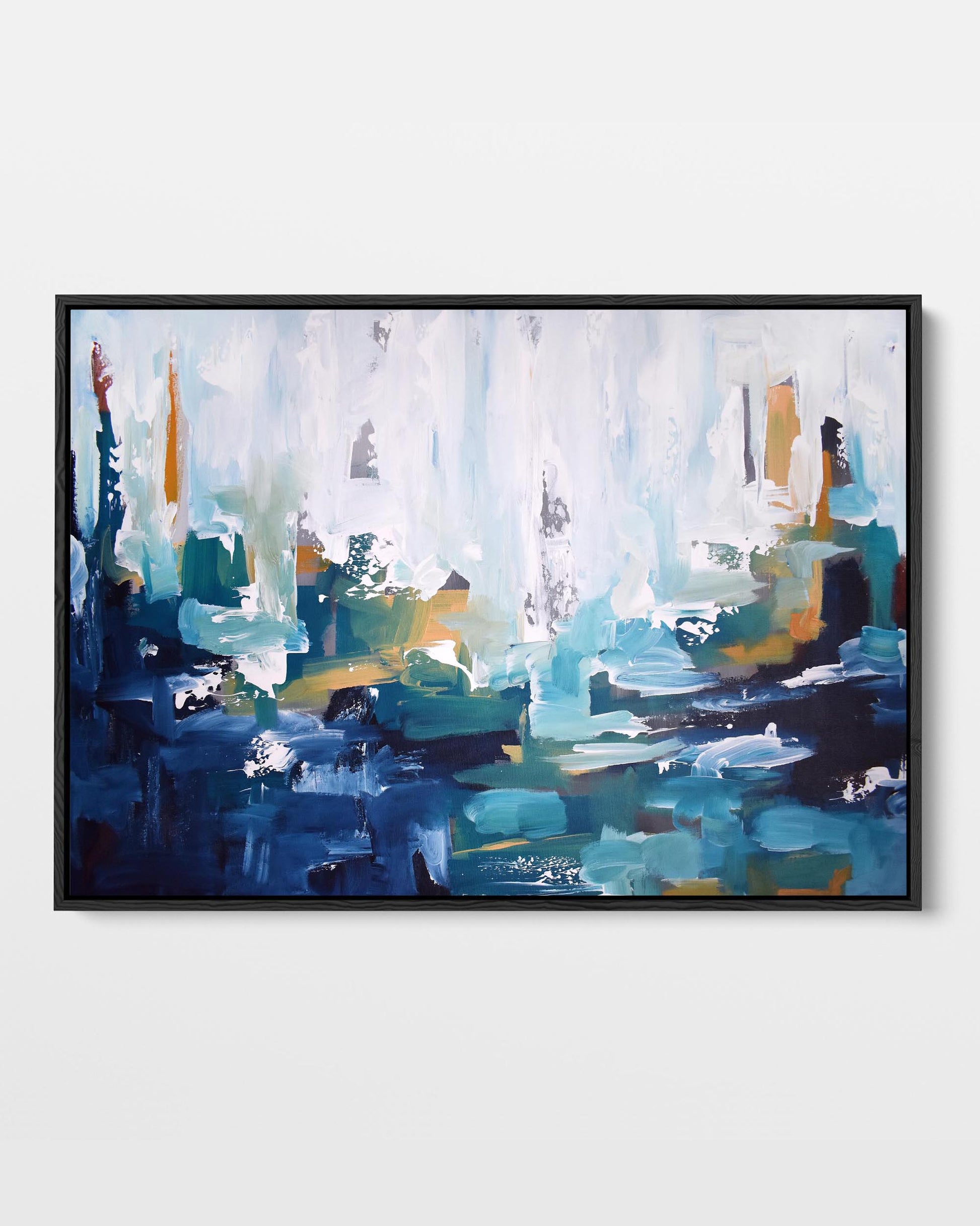 A framed canvas print with an abstract design featuring modern blue, teal, and gold tones.