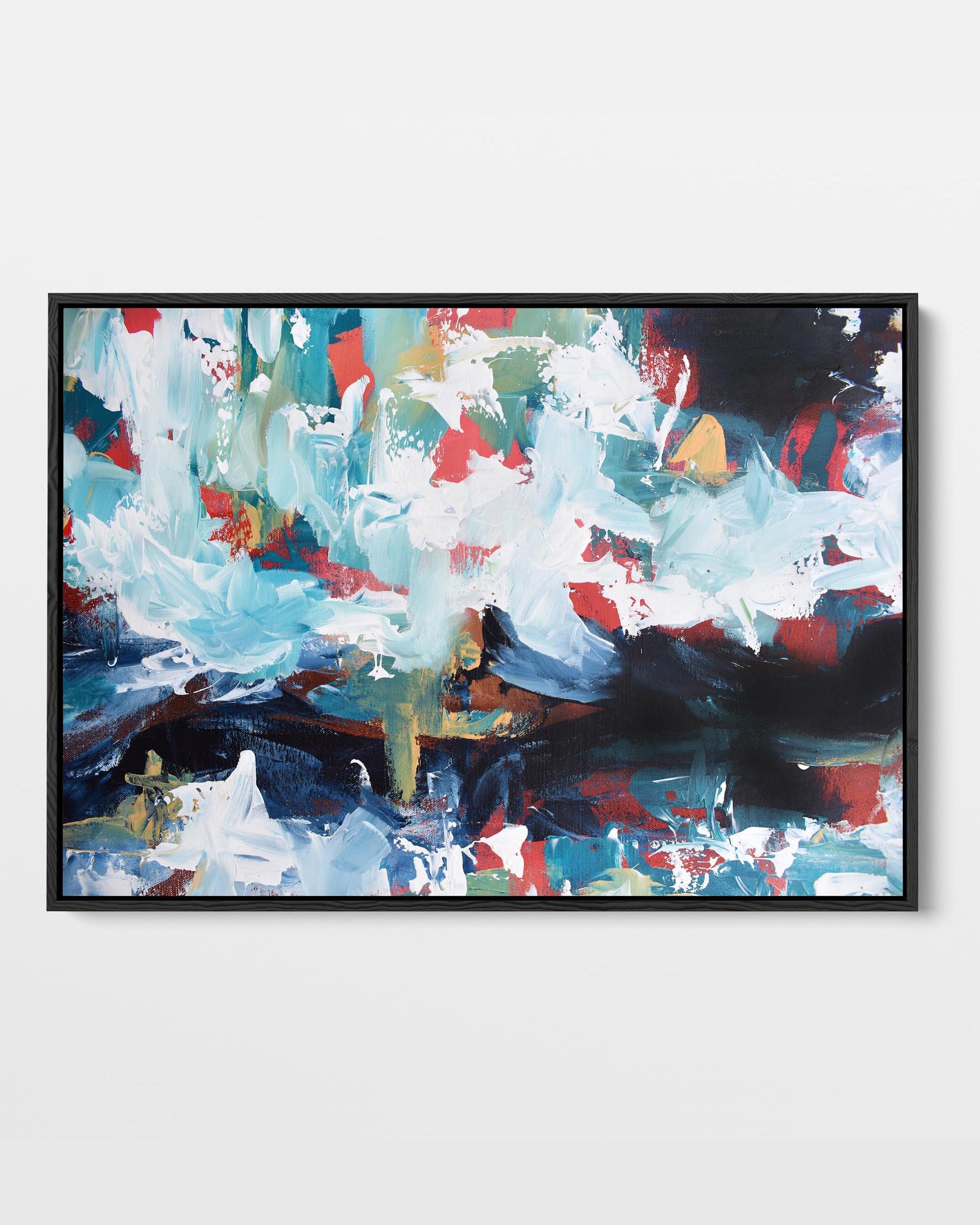 A framed canvas with an abstract design featuring modern blue, dark navy, white, and red tones.