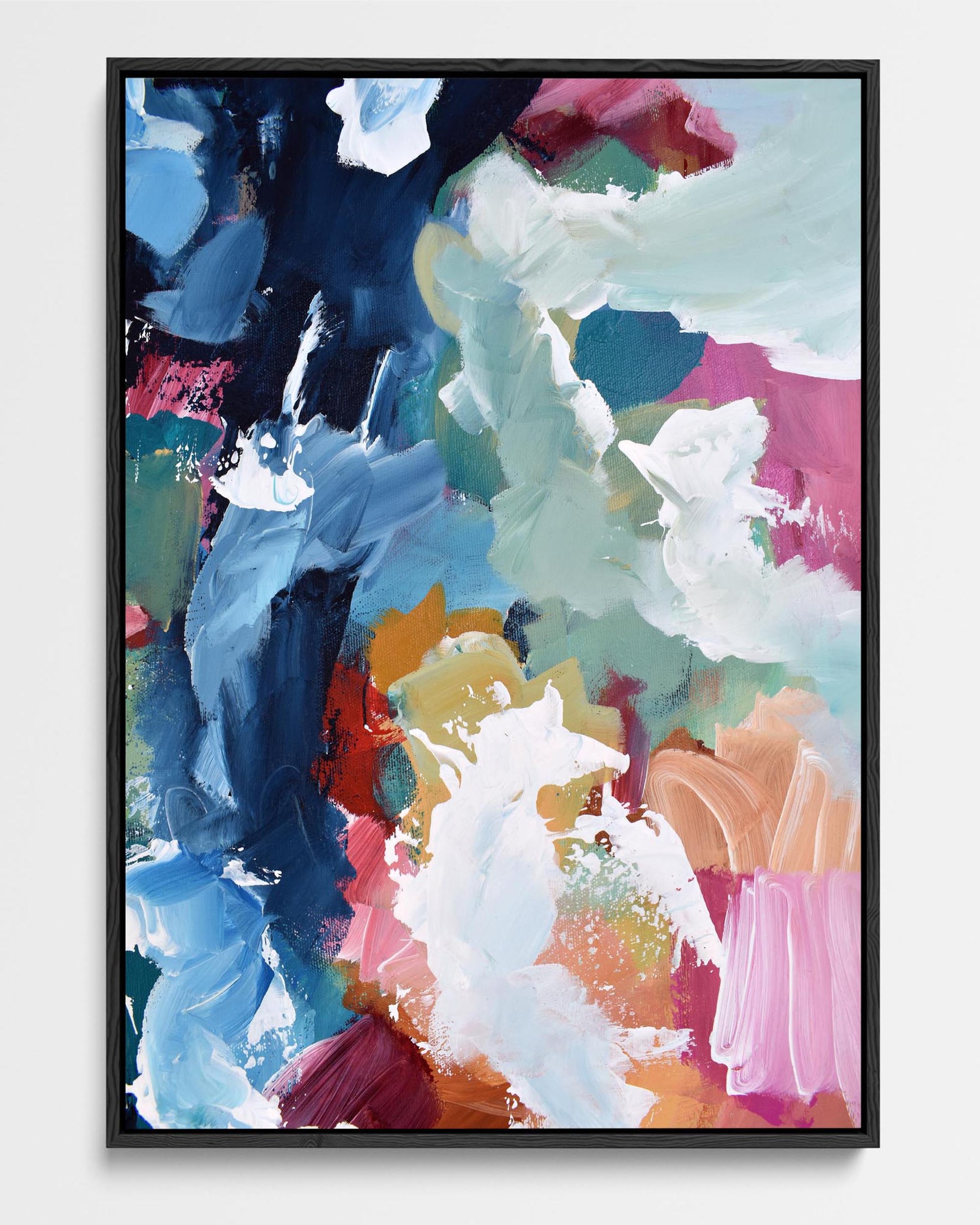 A framed canvas featuring an abstract design with modern blue, red, pink, and brown tones.