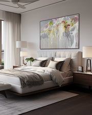 Modern bedroom with a large bed, abstract painting on the wall, and side tables with lamps.