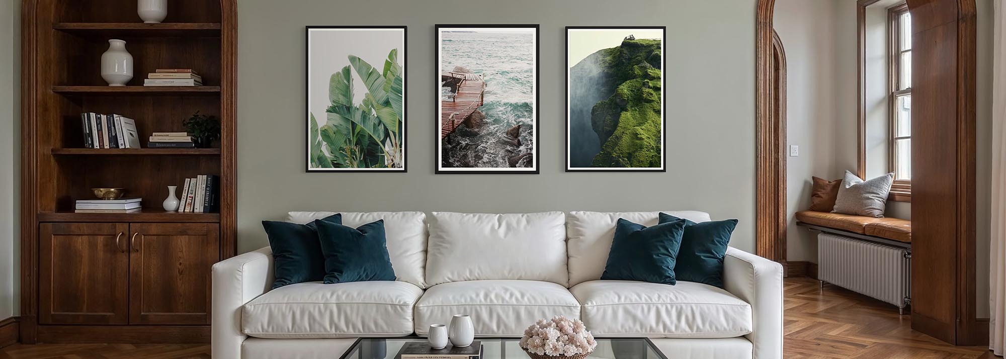 Living room with a white sofa, decorative pillows, and wall art.