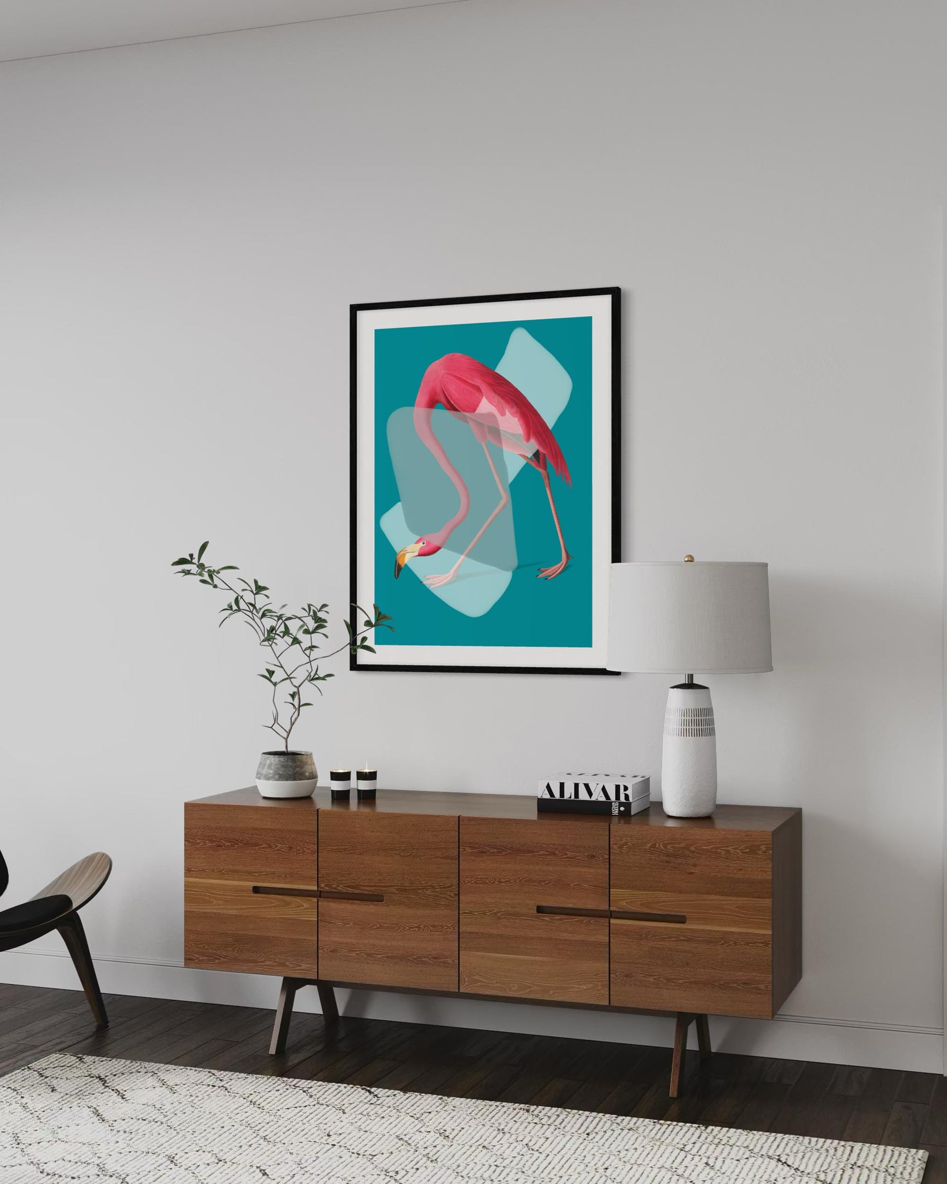 Modern living room with wooden sideboard, lamp, and flamingo artwork on the wall.
