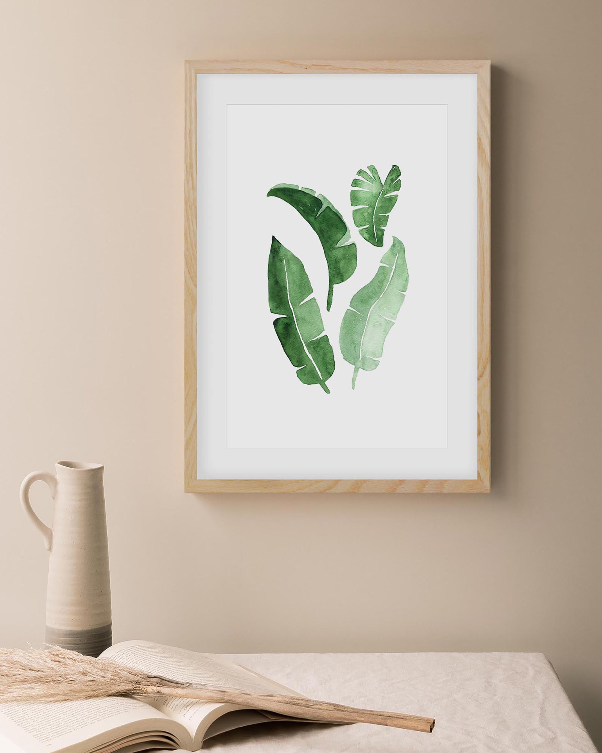 framed botanical leaves art print in an oak frame