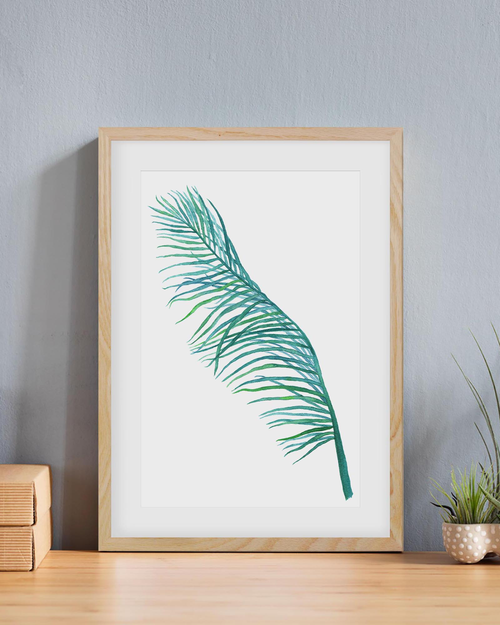 botanical art print frame in an oak frame on a table