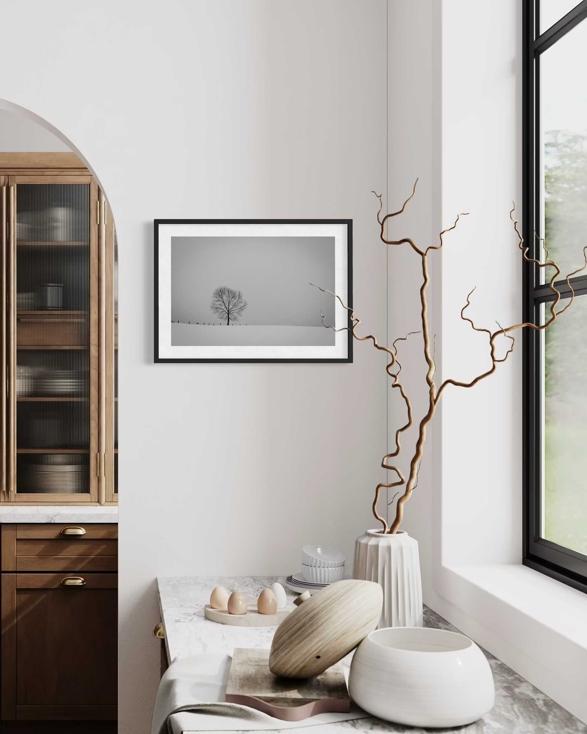 Modern interior with wooden cabinet, framed artwork, and decorative items.