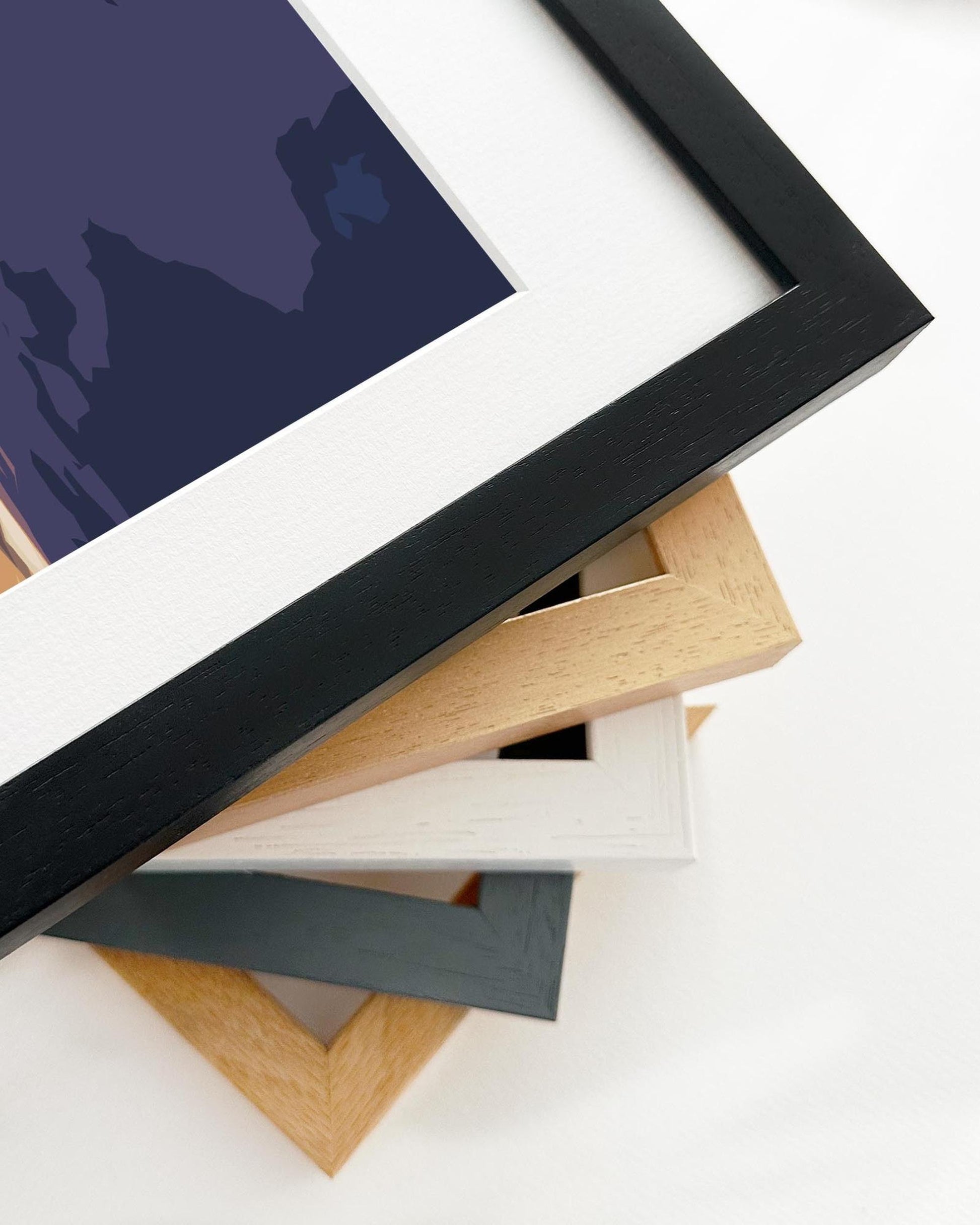 Stack of variously colored picture frames on a white background