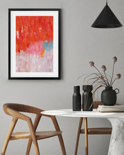 Modern interior with abstract art, wooden chair, and decorative items on a table.